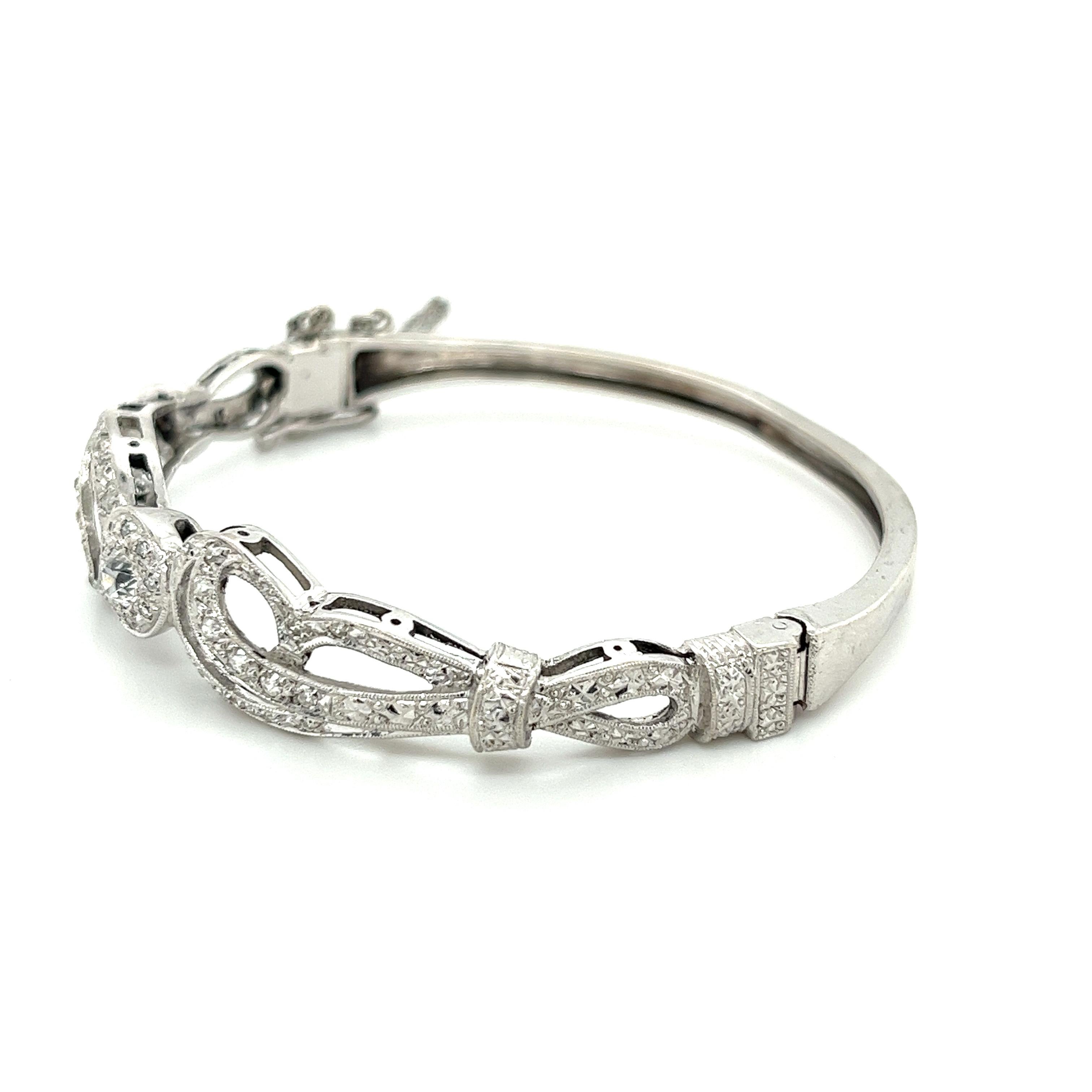 This Vintage Retro Style Diamond Bangle With Old European Cut Diamonds. Crafted in 14k White Gold, the bracelet features a total carat weight of 0.70 CTTW, with a dazzling Old European-cut diamond at its center, weighing 0.35 carats. The diamond