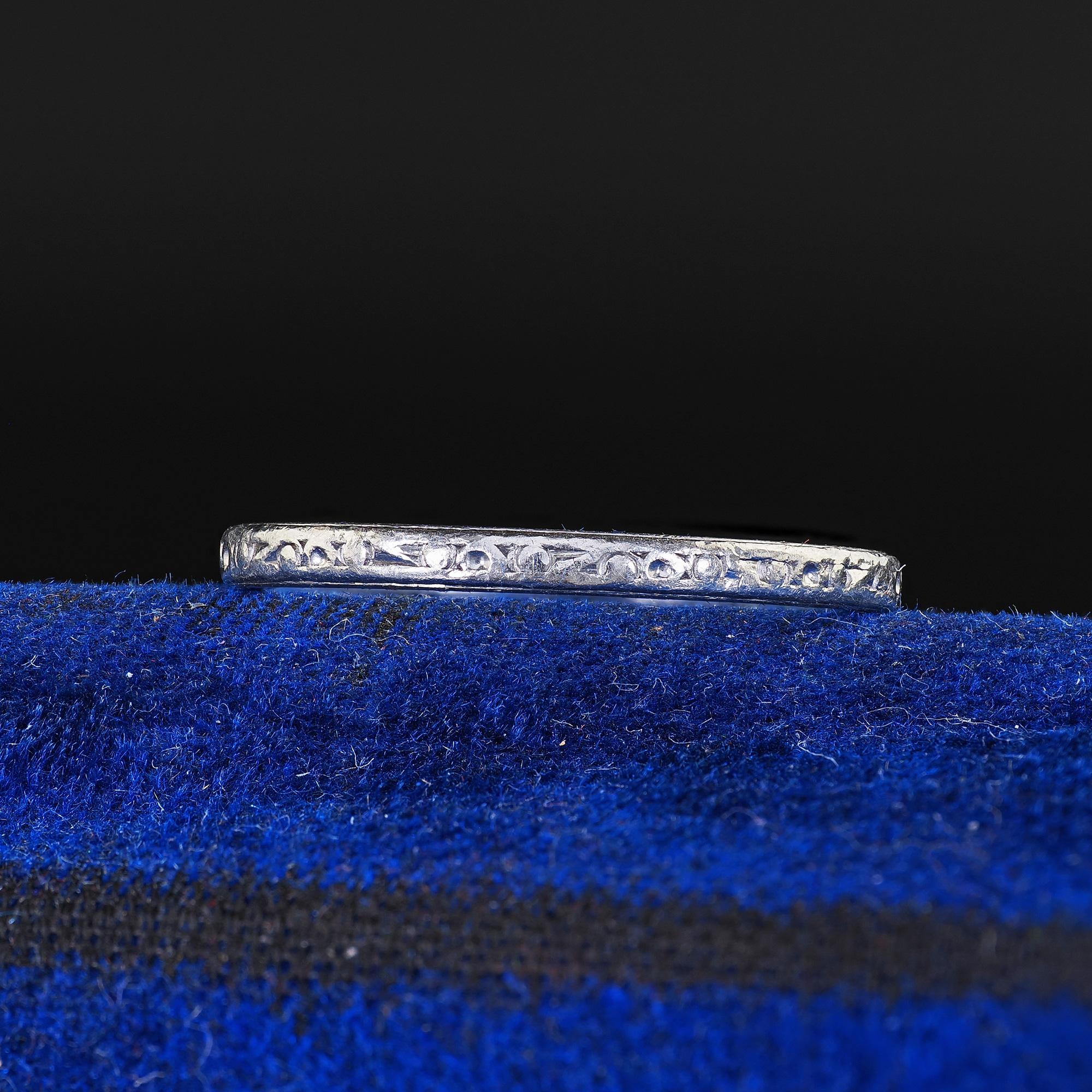 Beautiful Vintage Retro Platinum Classic Engraved Wedding Band Ring - 5 1/4. This gorgeous Retro engraved wedding band ring is crafted in platinum. The ring features beautiful engravings around the entire ring. The inside of the band is engraved 