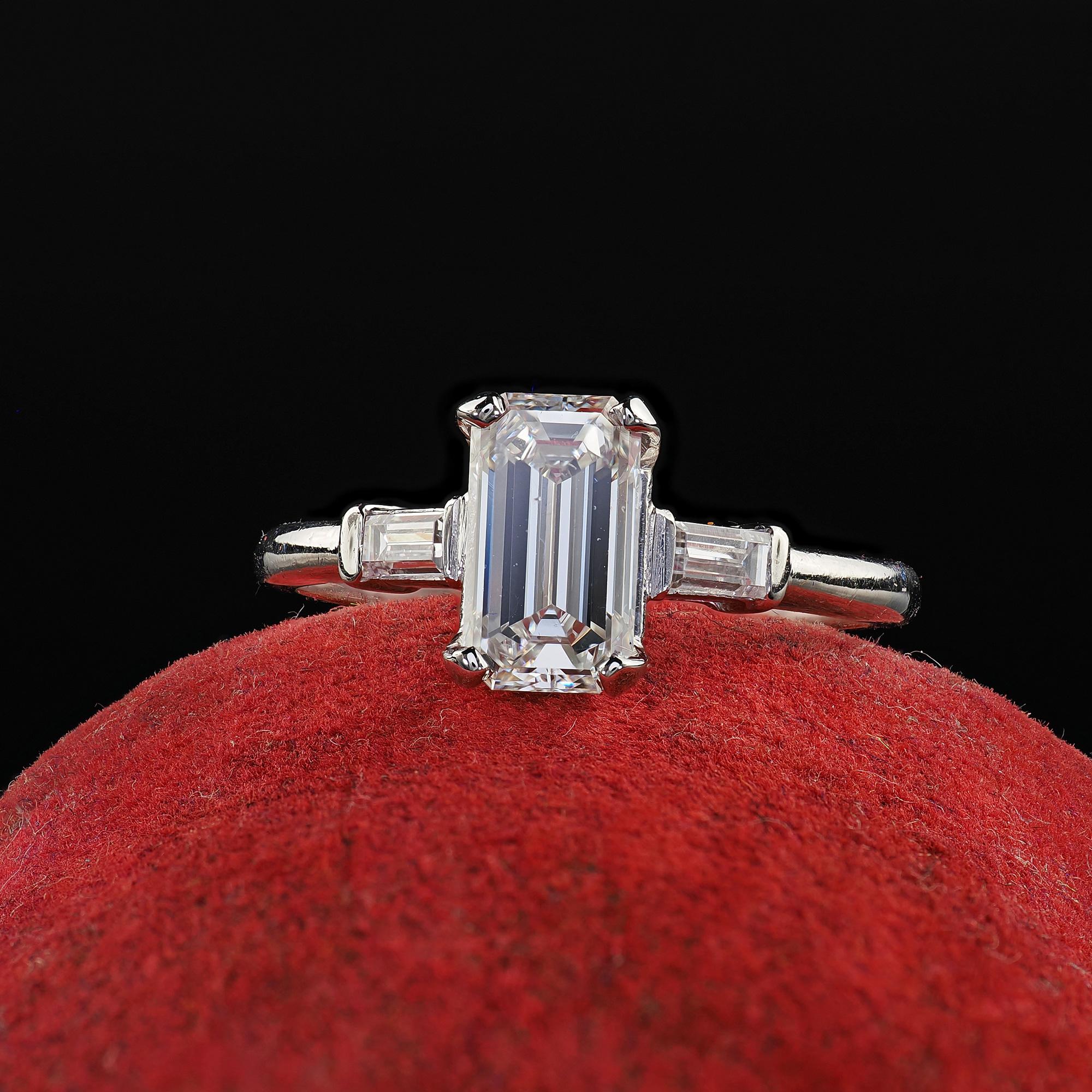 Beautiful Vintage Retro Platinum Emerald Cut Diamond Engagement Ring - GIA. This classic emerald cut diamond engagement ring is crafted in platinum. This beautiful ring features a bright emerald cut diamond in the center that has a GIA report. The