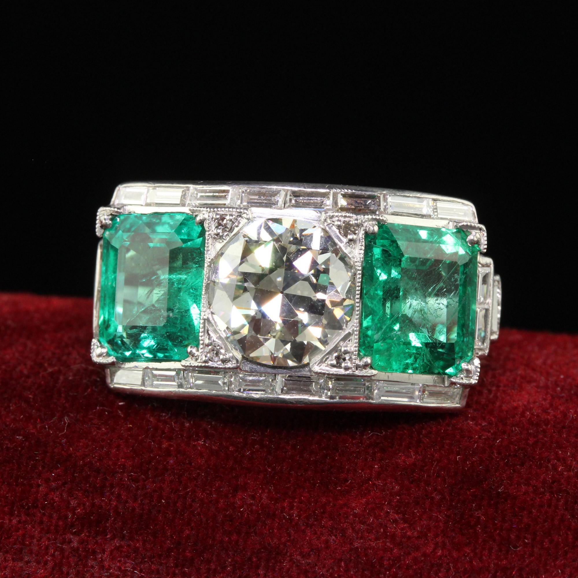 Beautiful Vintage Retro Platinum Old Cut Diamond and Emerald Three Stone Ring - GIA/AGL. This incredible three stone retro ring is crafted in platinum. The top of the ring holds a gorgeous transitional cut diamond that has a GIA report as well as