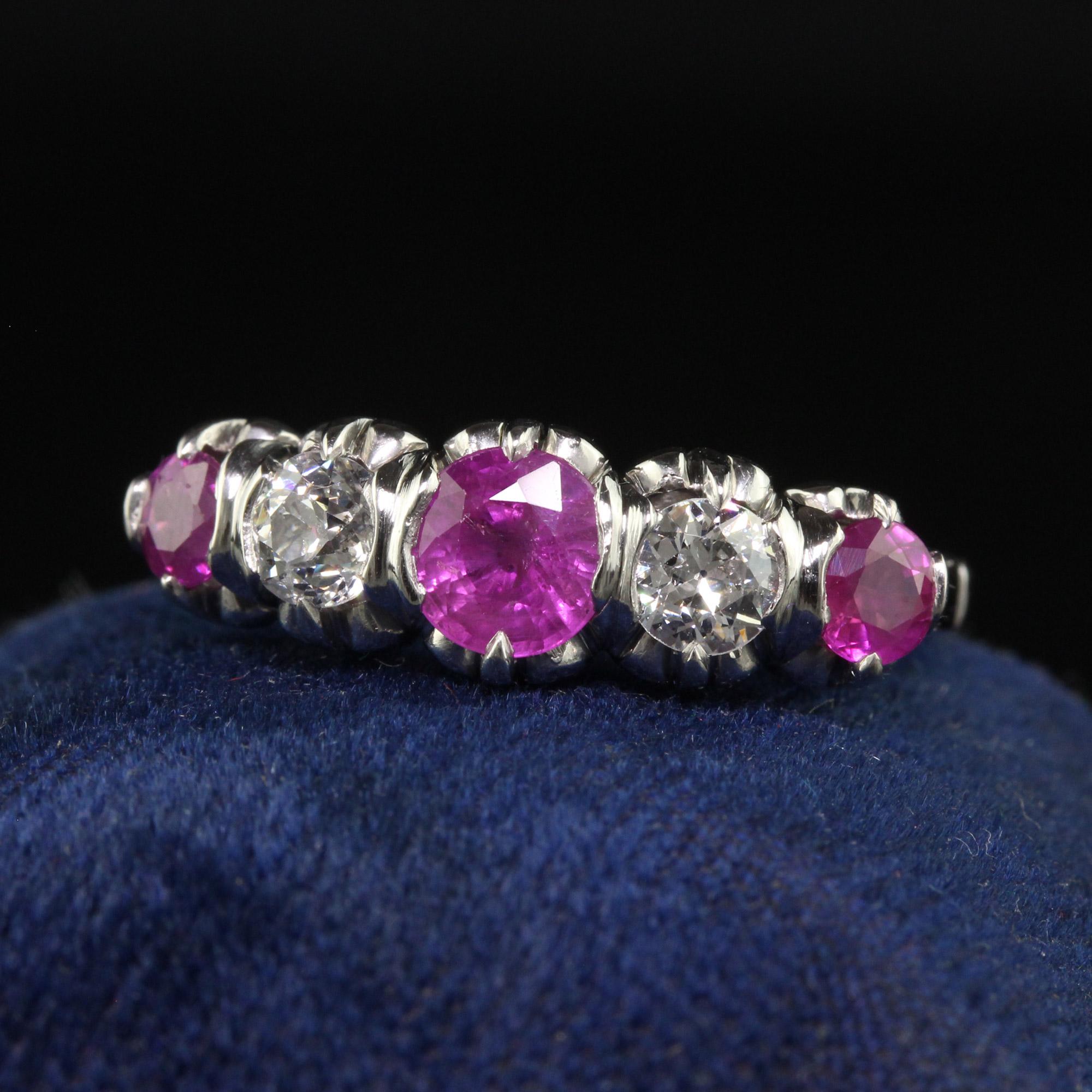 Beautiful Vintage Retro Platinum Old Euro Diamond and Pink Sapphire Five Stone Ring. This beautiful vintage retro five stone band is crafted in platinum. The ring holds three beautiful natural pink sapphires and two old European cut diamonds. The