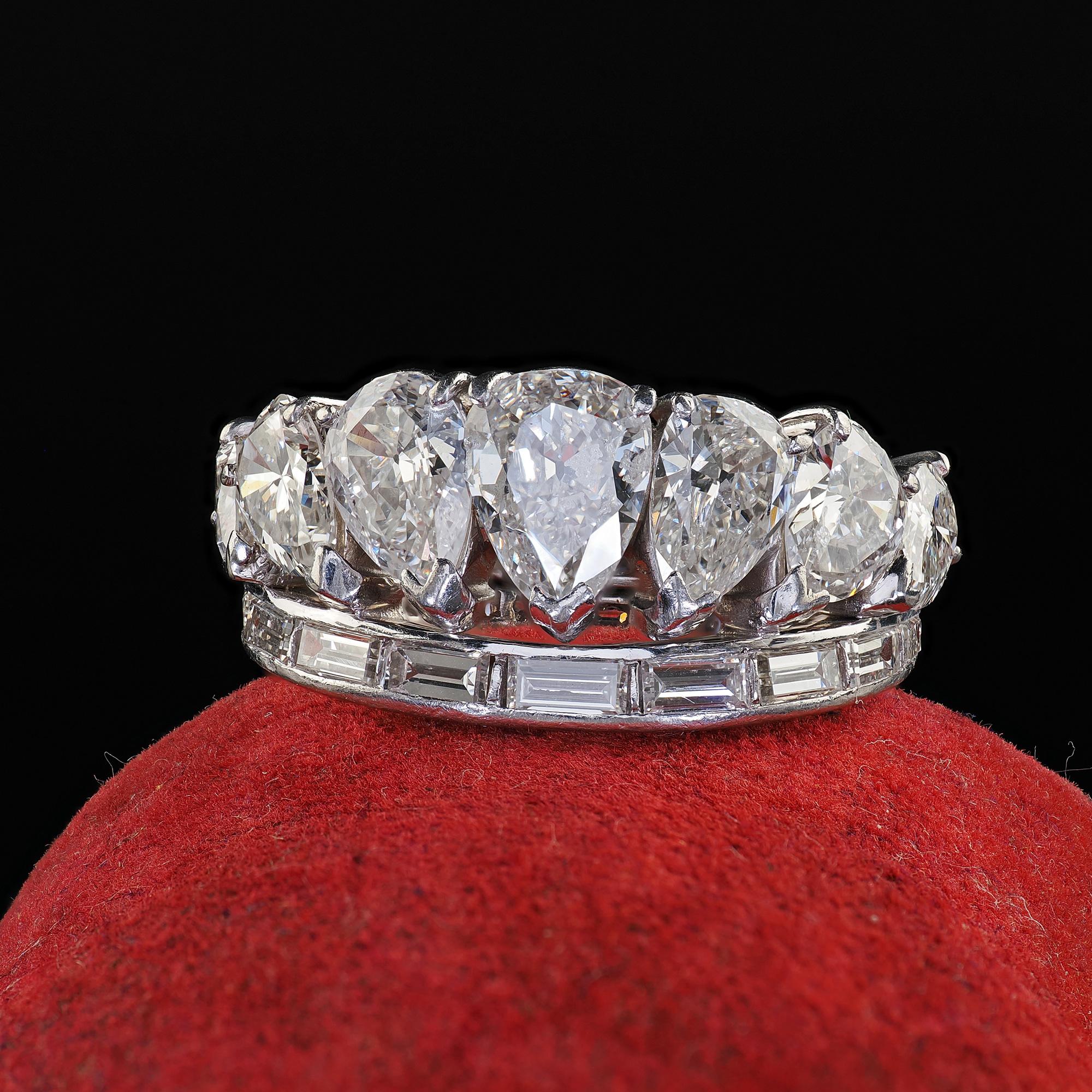 Beautiful Vintage Retro Platinum Old Pear Cut and Baguette Diamond Eternity Band Ring. This incredible Vintage Retro old pear cut and baguette diamond eternity band ring is crafted in platinum. This amazing ring has a row of large old cut pear shape