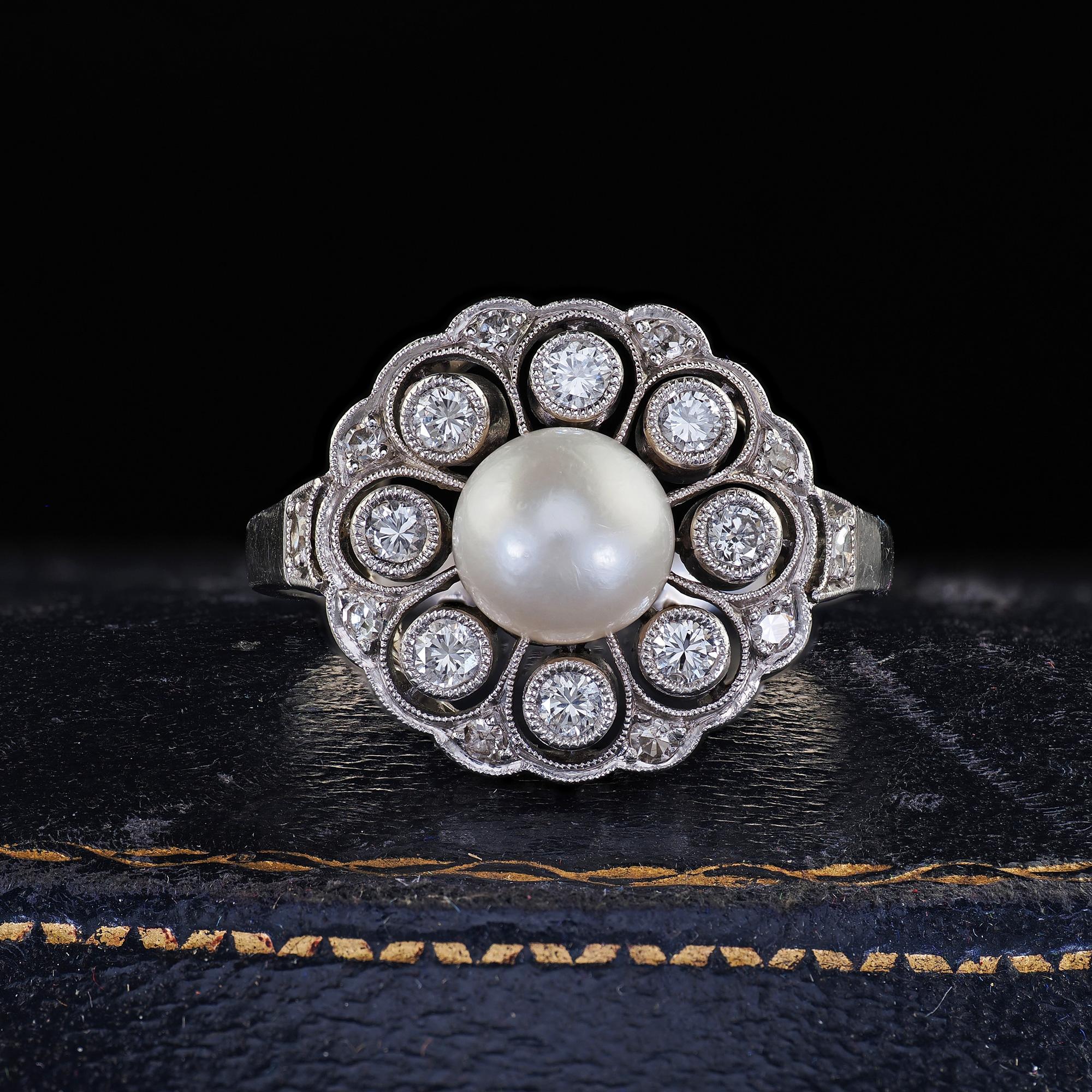 Beautiful Vintage Retro Platinum Pearl and Old Cut Diamond Filigree Cocktail Ring. This gorgeous vintage Retro diamond and pearl cocktail ring is crafted in platinum. The ring features a beautiful pearl set in the center of a vintage mounting that