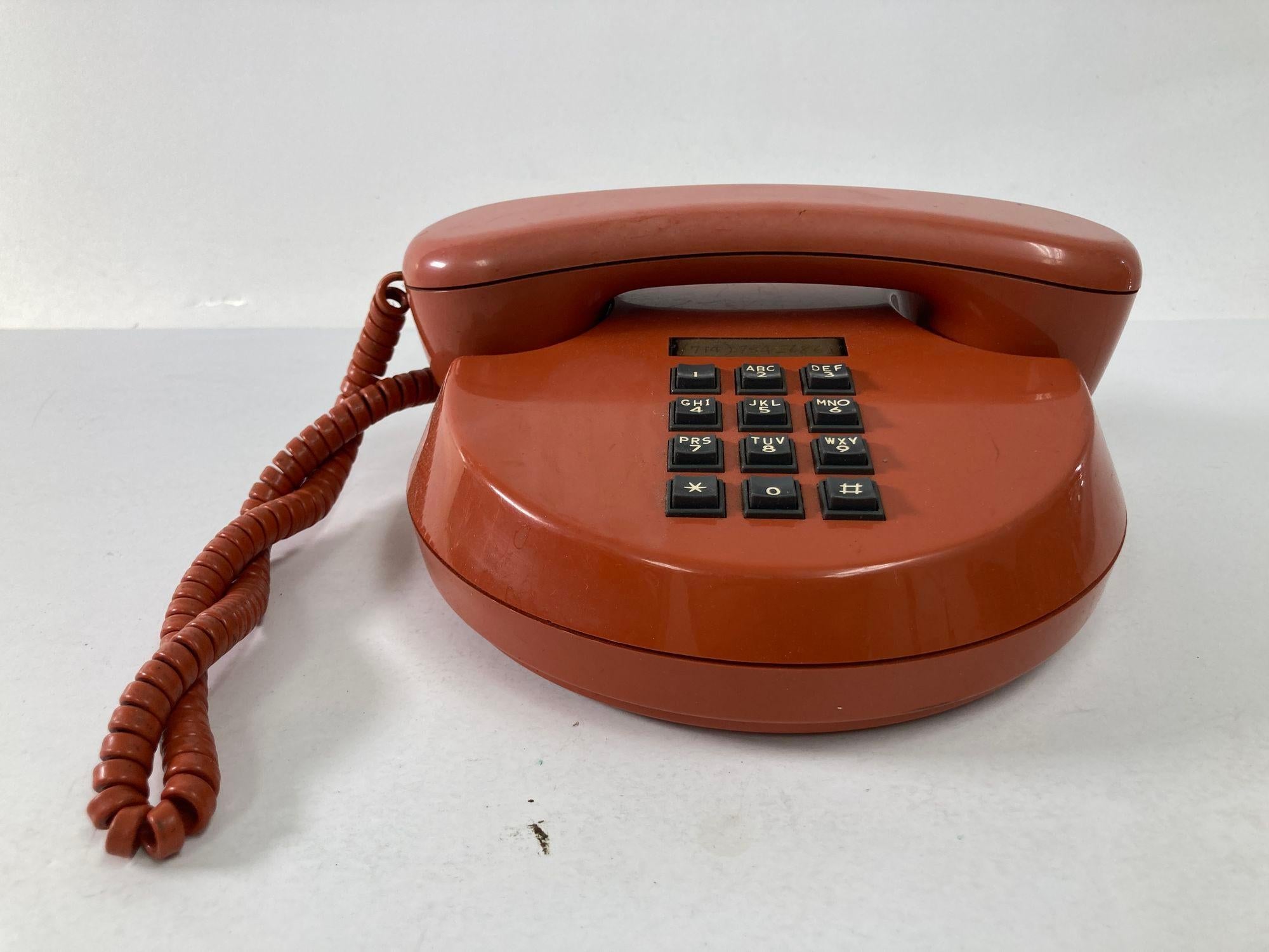 Vintage bakelite push-button round telephone in burnt orange color from 70s to 80s.
Vintage Telephone 1970s Round Push Button Northern Telecom Mod Retro.
Great collectible phone to add to your collection. Burnt orange, black buttons.
Made in