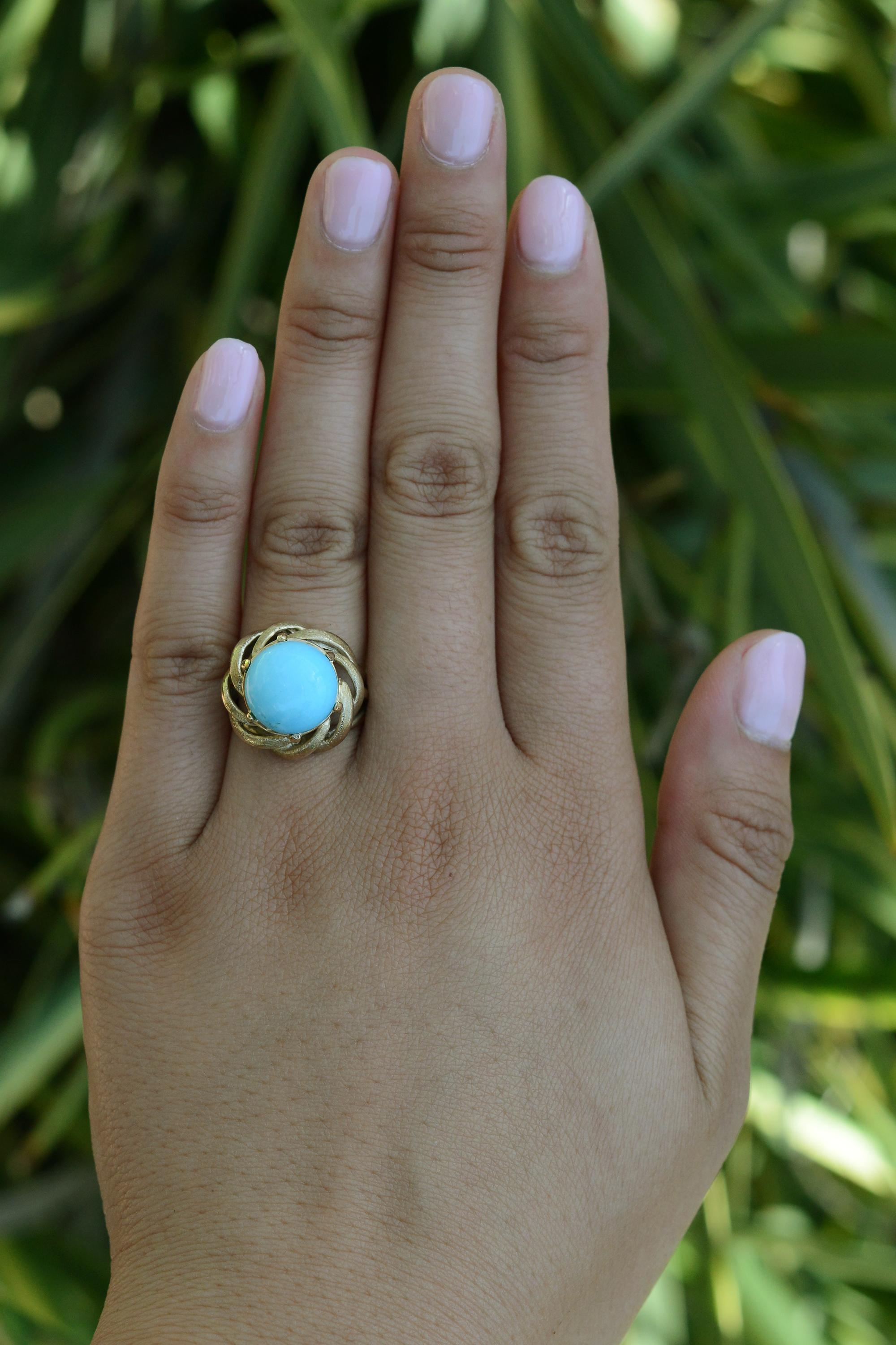 An affordable vintage estate treasure, right out of a fairy tale! This turquoise cocktail ring displays vibrant hues and excellent symmetry. Known for it's pure color, a 5.76 carat Arizona sleeping beauty turquoise gemstone is proudly set in a