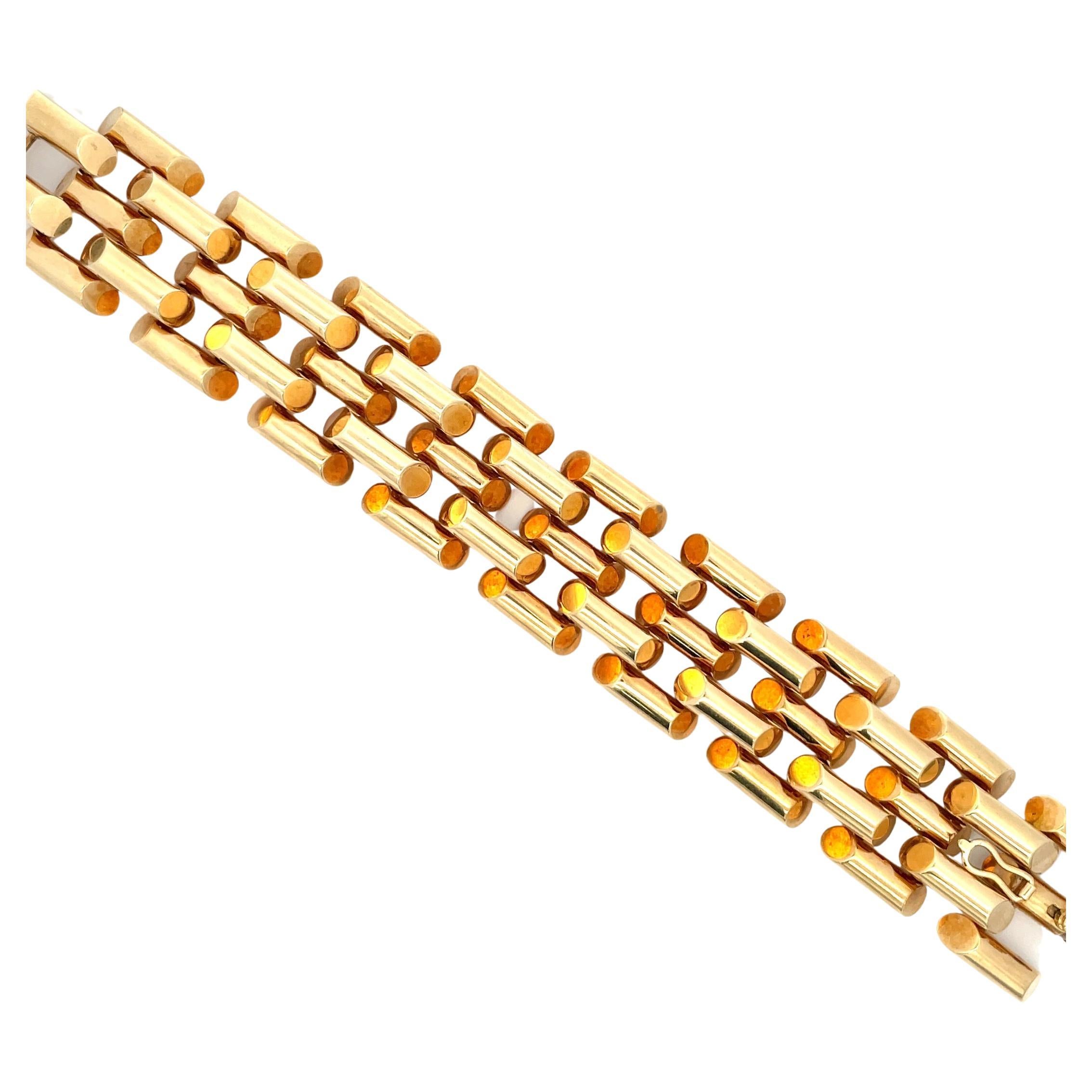 Retro style bracelet featuring 5 rows of a tank motif weighing 69.3 grams in 14 Karat Yellow Gold. 
Great looking bracelet! 