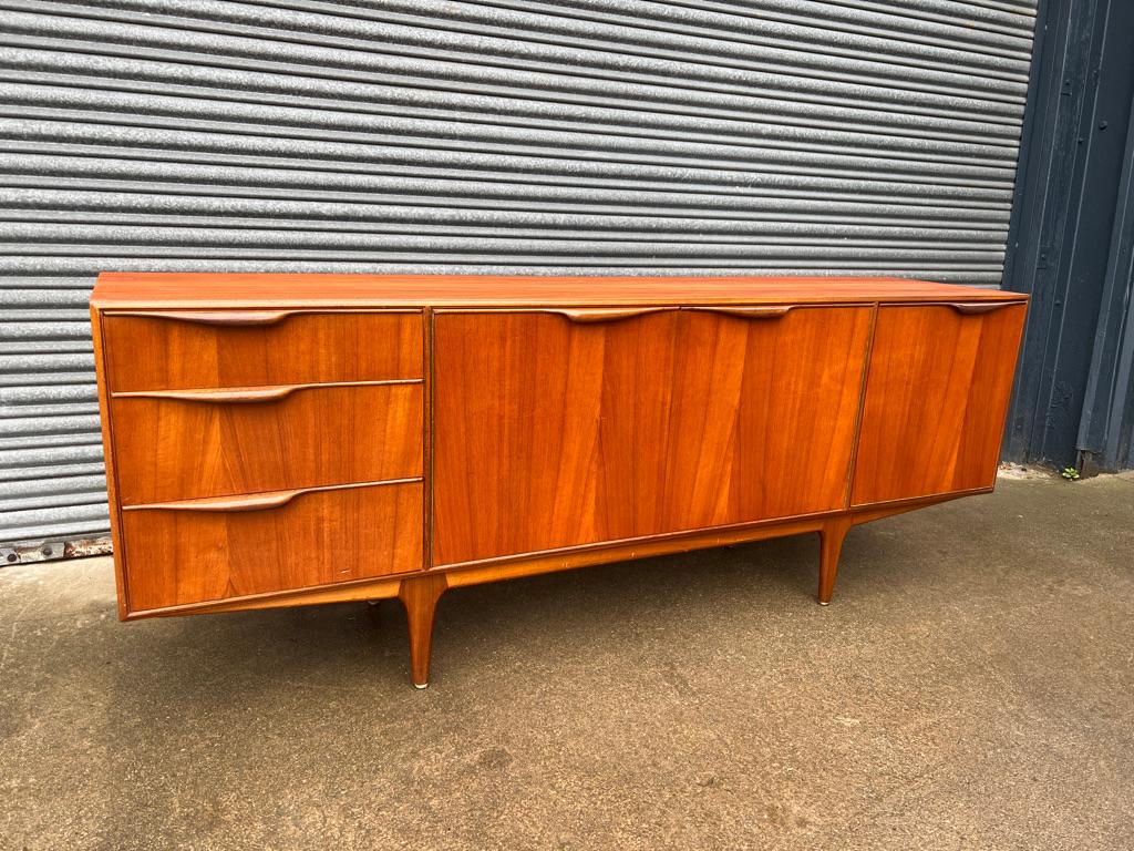 Vintage 1960s McIntosh sideboard by Tom Robertson. It has three drawers, cupboard space, and a drinks section with a useful pullout shelf. Credenza is in very good original condition, photo's say it all!