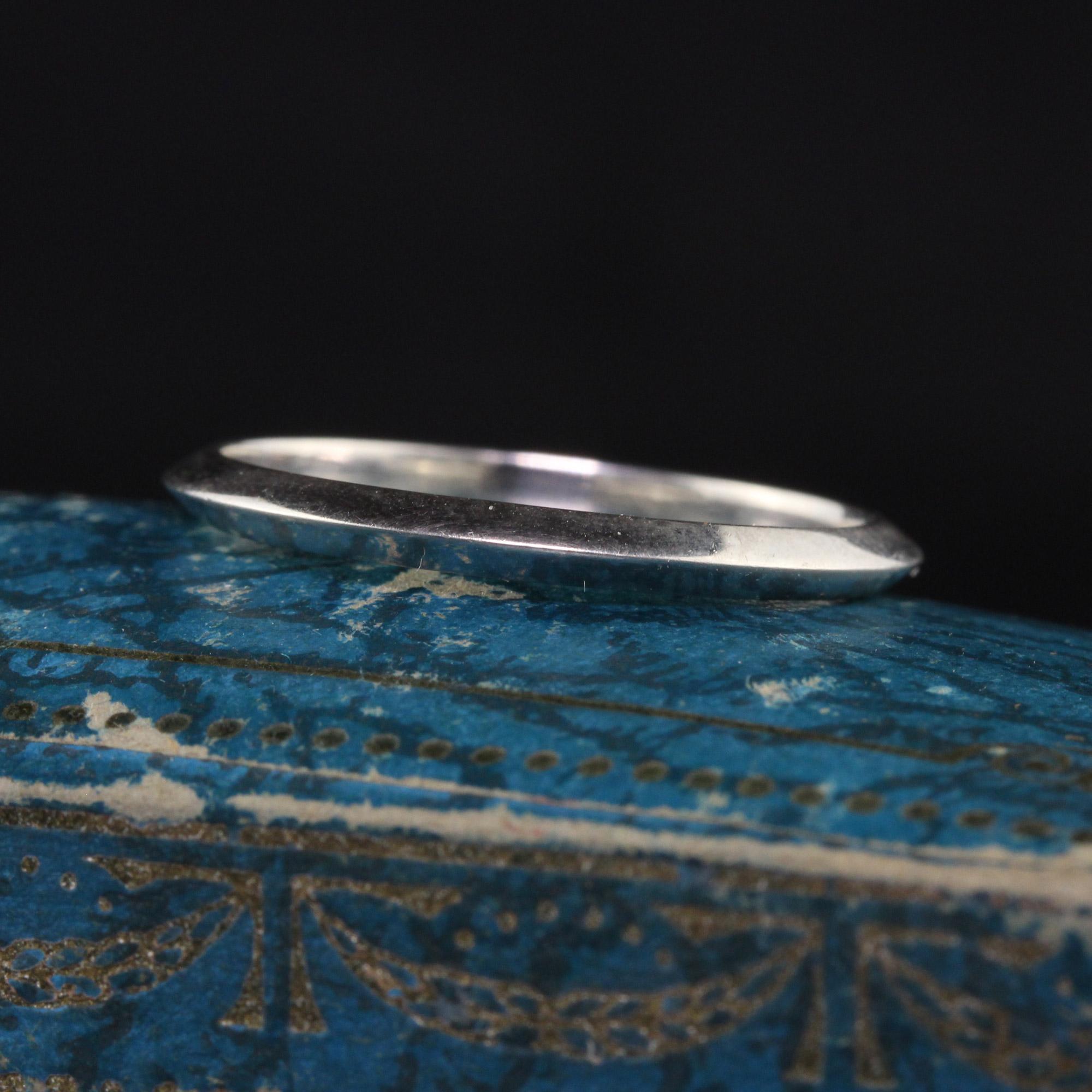 Beautiful Vintage Retro Tiffany and Co Platinum Knife Edge Wedding Band - Size 8. This classic wedding band is crafted in platinum and made by Tiffany and Co. The band has a knife edge design and is in great condition.

Item #R1277

Metal: