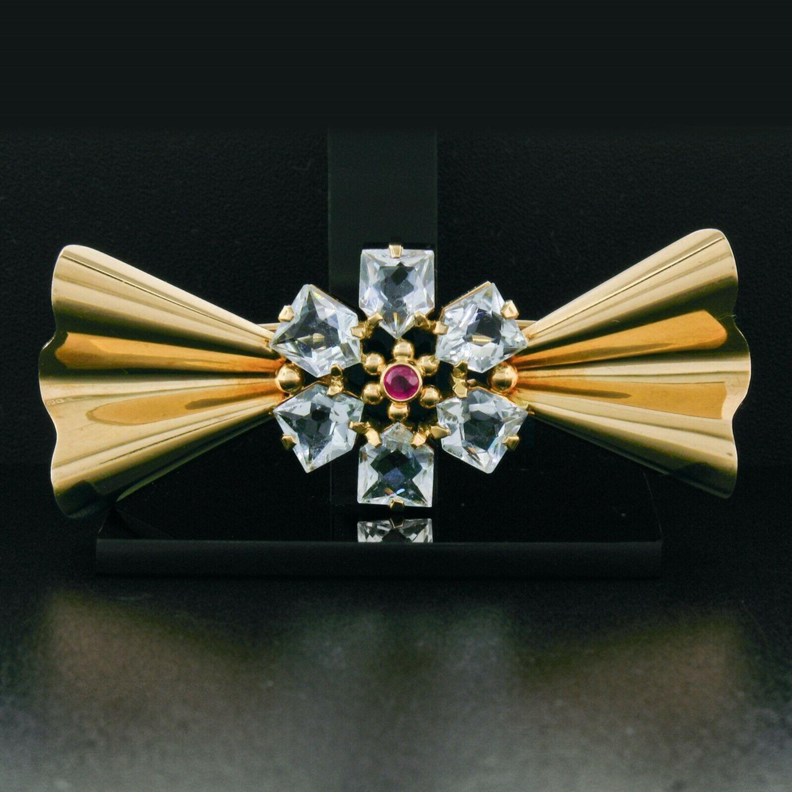 Here we have a gorgeous and very lovely ribbon style brooch crafted and designed by Tiffany & Co. in solid 14k rose gold and displays beautiful patina which has been preserved along with the original finish throughout. The center of the bow is bezel