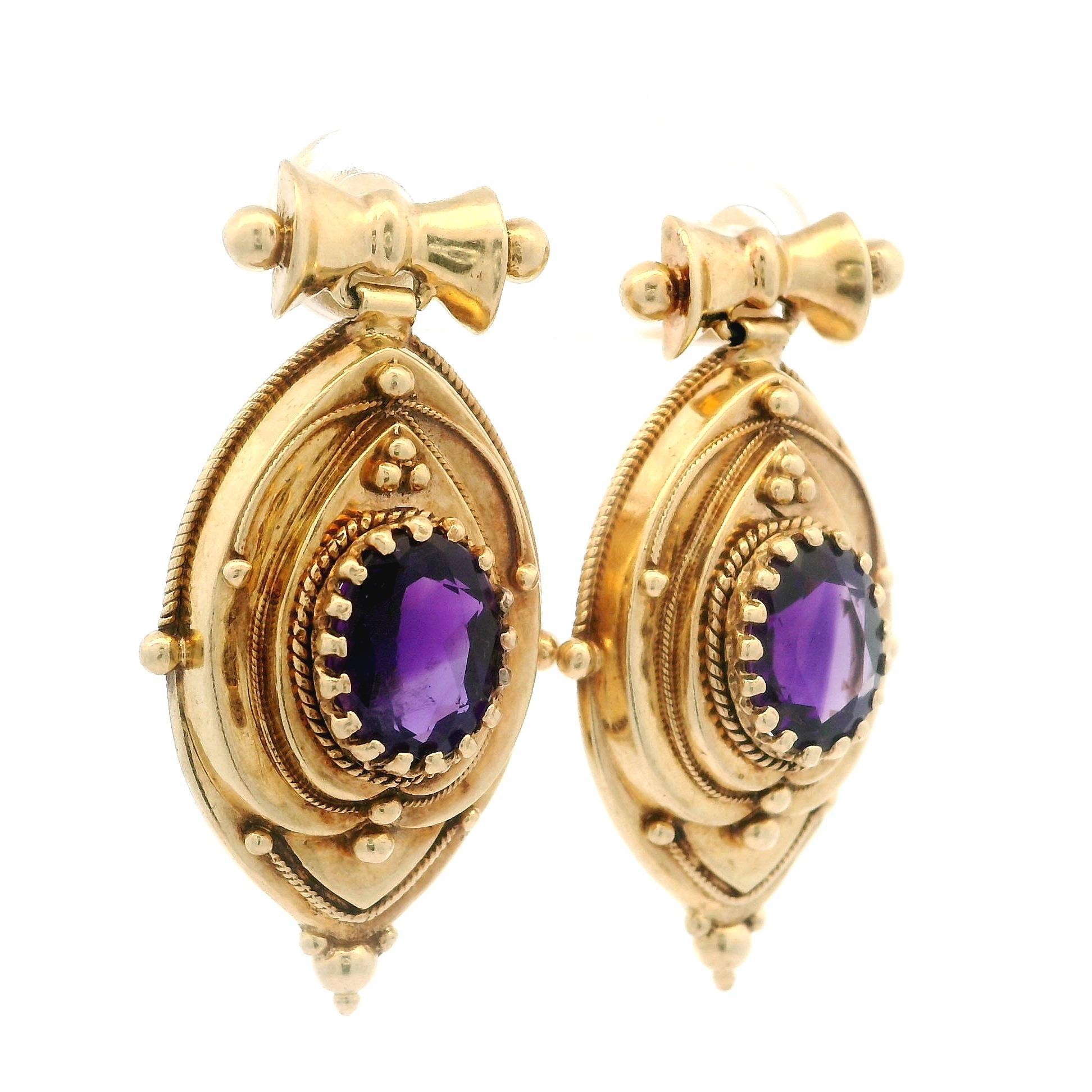 –Stone(s)–
(2) Natural Genuine Amethyst - Oval Cut - Multi Prong Set - deep Rich Purple Color - 8.4x6.7mm (approx.)

Material: Solid 14k Yellow Gold
Weight: 12.46 Grams
Backing: Post w/ Butterfly clasp (Pierced ears are required.)
Overall Width: