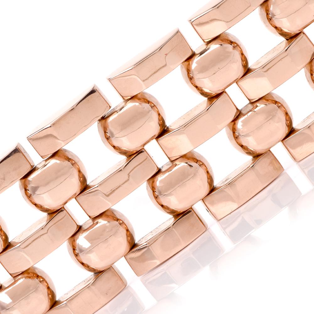 This vintage 1960s wide tank track link bracelet is crafted in 18Karat rose gold. Made up of 5 adjacent rows of tank and circular links. Weighing 73.4 grams, measures 7 ¼ inches around the wrist and 31.5mm wide. Secures with two sturdy clasp, bears