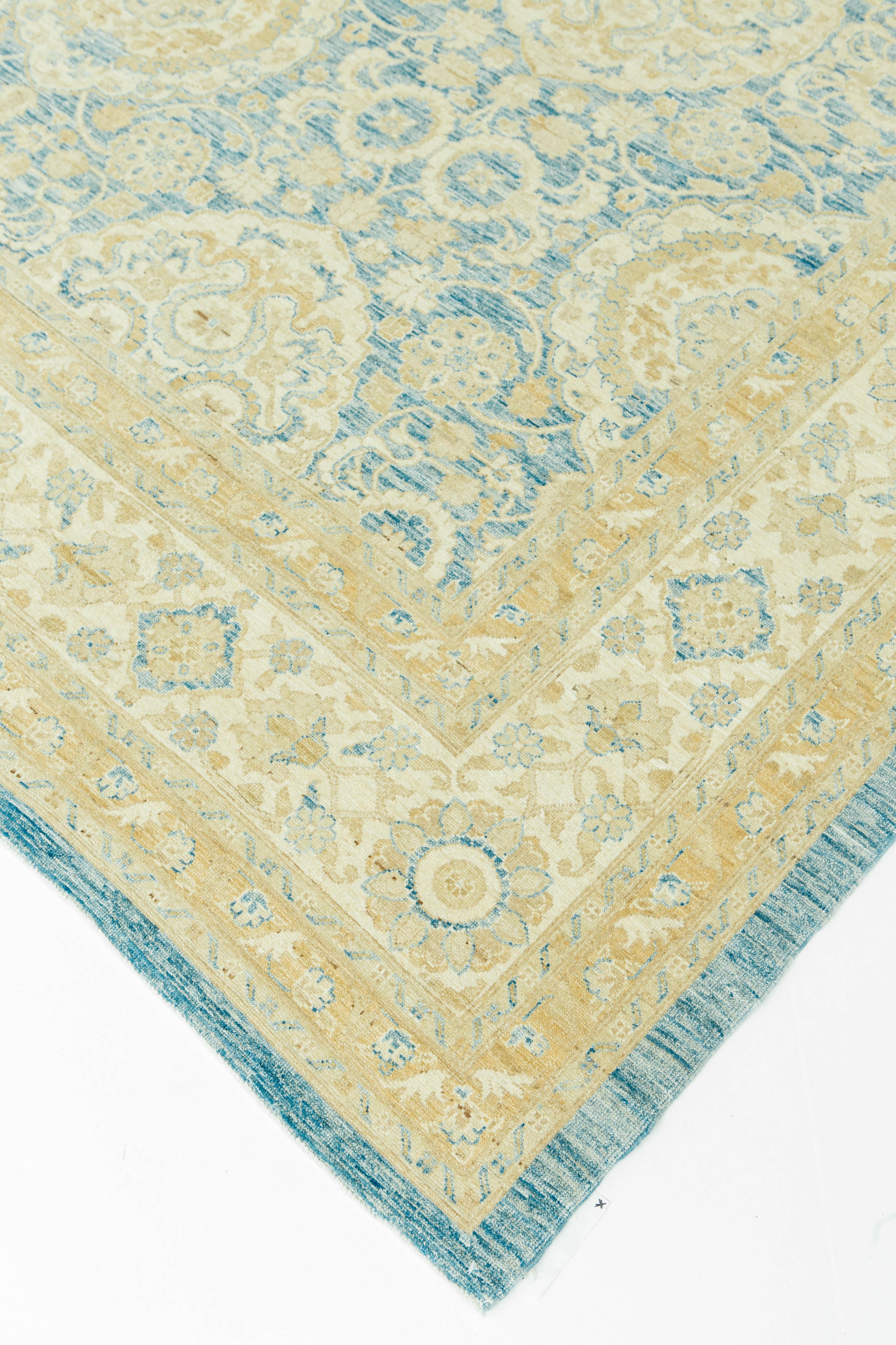 This vintage Agra style recreation is both elegant and detailed to perfection. Weavers of Agra were masters at vegetable dying as they popularized gold and soft mid-tone blues. The colors and medallion motifs of this rug weave together into a