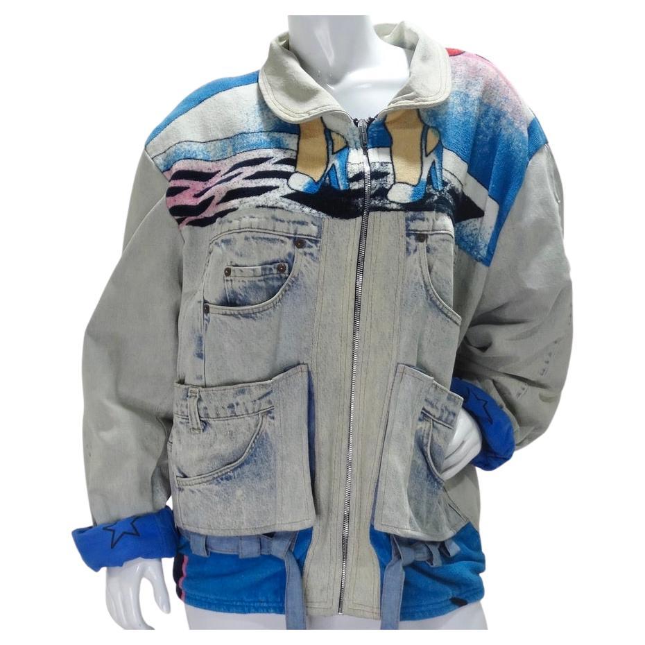 Extra special 'Too Cute' up-cycled jacket circa 1980s! Reworked denim contrasts a Betty Boop graphic terry cloth to create this one of a kind statement piece. Featuring four pockets on the front and two on the back, a zipper and a very 80s collar in
