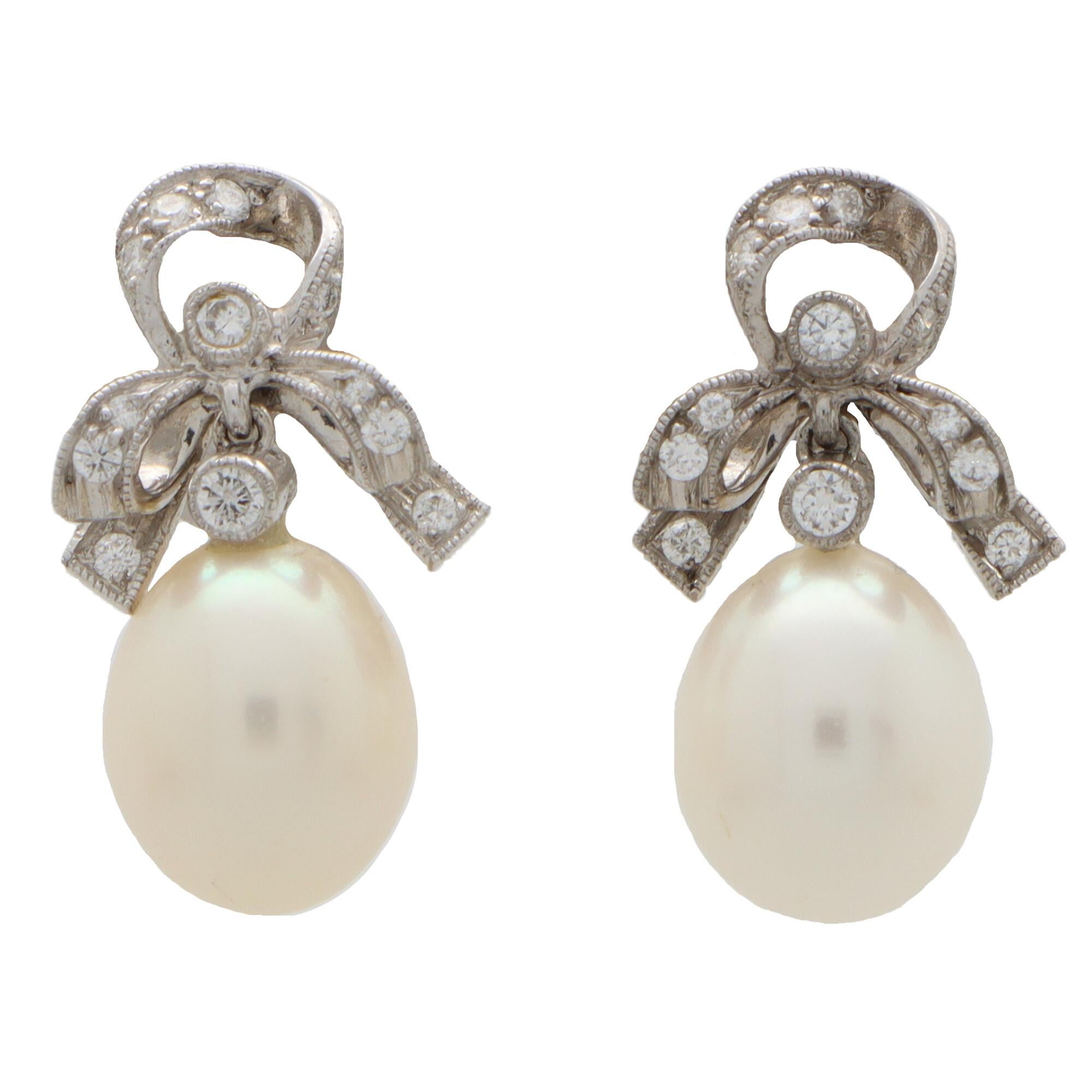 Vintage Ribbon Topped Pearl and Diamond Drop Earrings in 18k White Gold In Excellent Condition In London, GB