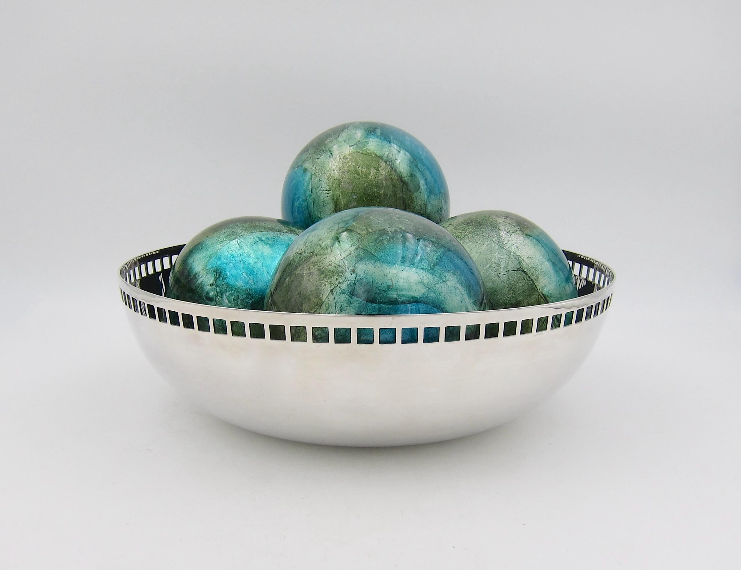 A Modernist bowl with a band of openwork squares, a motif favored by Josef Hoffmann and the Weiner Werkstätte, designed in silver plate by American architect Richard Meier (b. 1934) for Swid Powell in 1983. The modernist fruit bowl was part of Swid