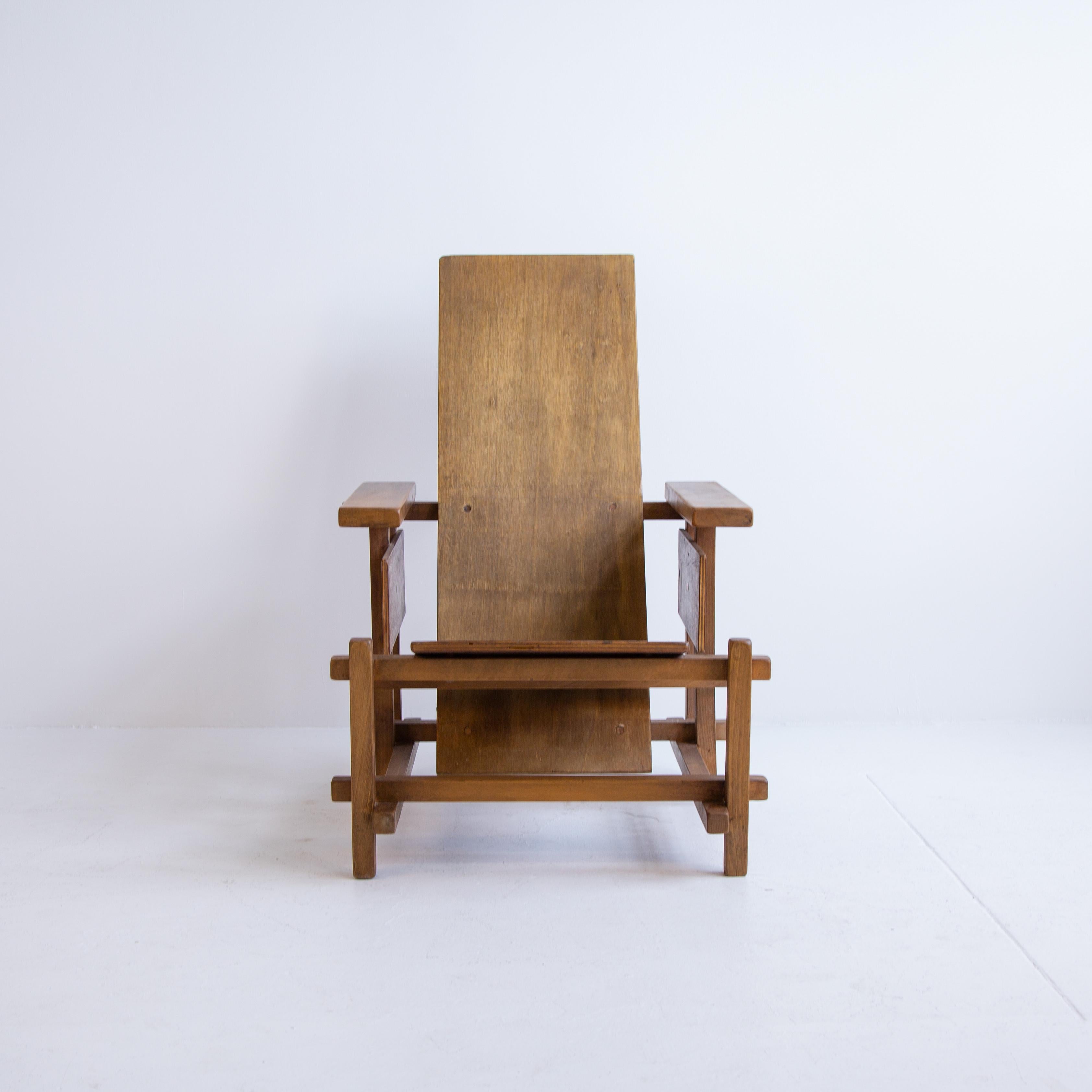 Rare prototype of the iconic red and blue chair designed in 1932 by Gerrit Rietveld. Chair has a unique stained woodwork with a slatted seat for back comfort. This chair exudes tons of character with great patina that would be perfect as an