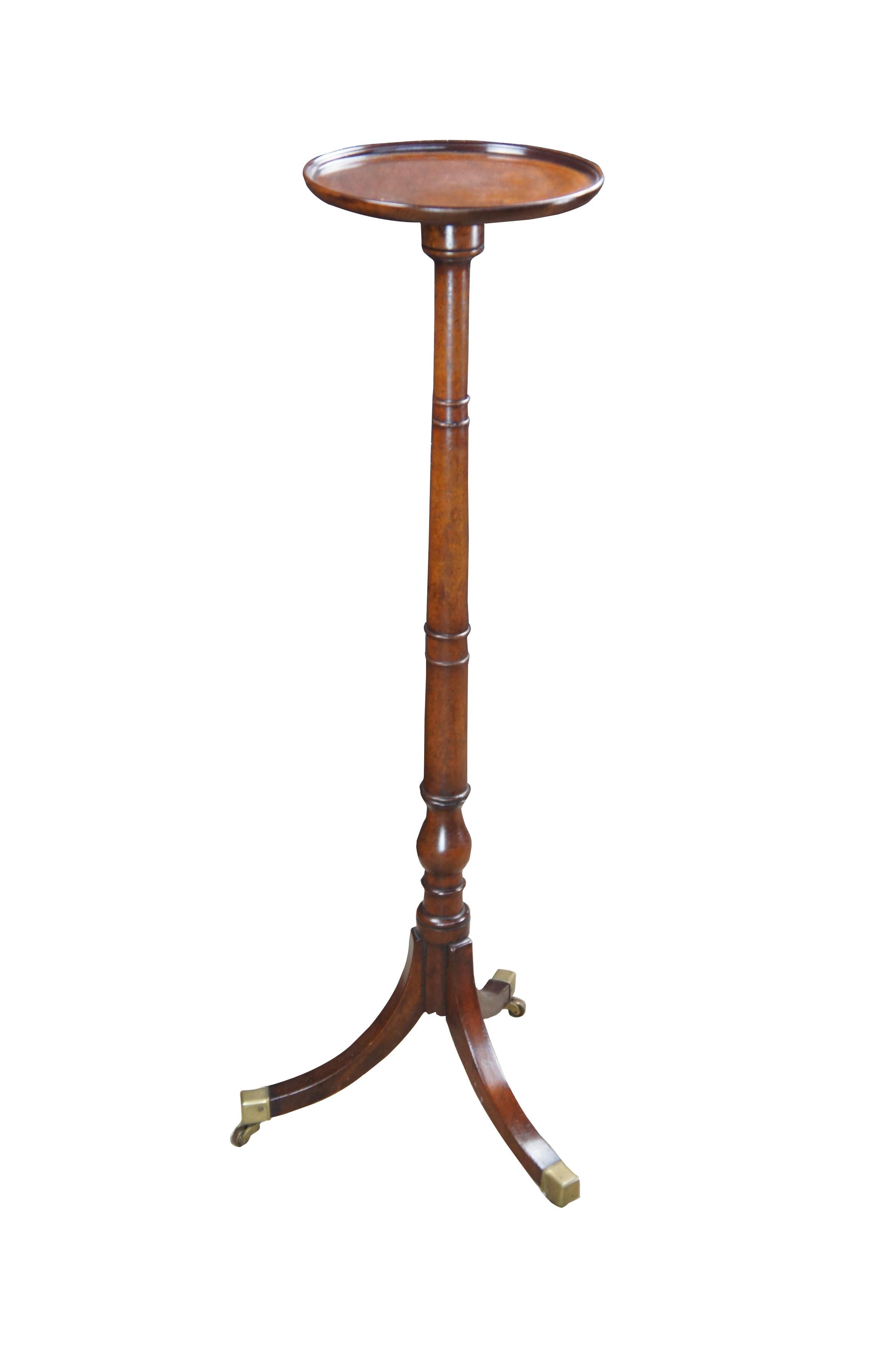 Mid 20th Century English Regency Style Candlestand by Riffemoor Inc.  Riffemoor was an antique and interior design business in american that specialized in importing fine furniture from England.  This beautiful English Regency style example features