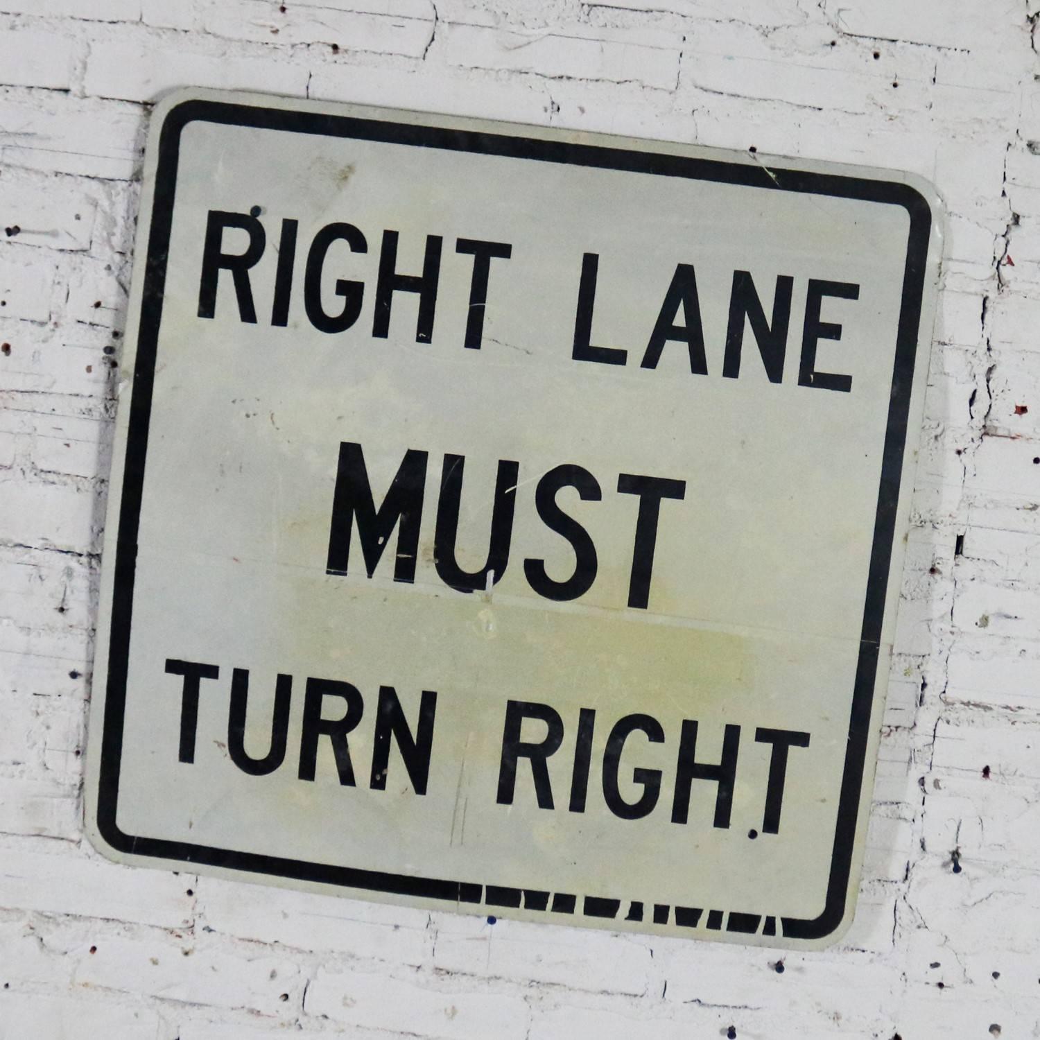 Awesome vintage steel Right Lane Must Turn Right traffic sign. This is a large sign and is in fabulous vintage condition with just the right amount of age and use patina. Please examine photos, circa 20th century.

Right lane must turn right, but
