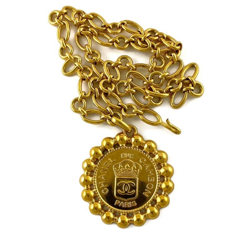 Vintage RIHANNA CHANEL Logo Heraldic Seal Medallion Necklace

Measurements:
Height: 2.95 inches (7.5 cm)
Width: 2.75 inches (7 cm)
Chain: 31.69 inches (80.5 cm)

As seen on RIHANNA.

Features:
- 100% Authentic CHANEL.
- Long chain that could be used