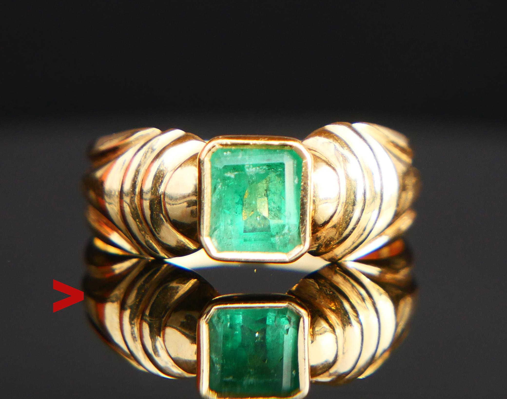 Elegant vintage Emerald Ring, the carved band in solid 18ct Yellow Gold + bezel set natural emerald cut Emerald stone of deep /strong Green color 6 mm x 5 mm x 3.75 mm deep / ca. 0.85 ct

Hallmarked 18K. Size: Ø 7US / 17.35 mm. Weight: 3.7