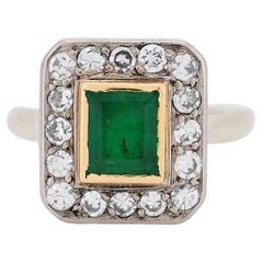 Vintage ring (Circa 1950) in 18-carat gold, set with a natural emerald and diamo