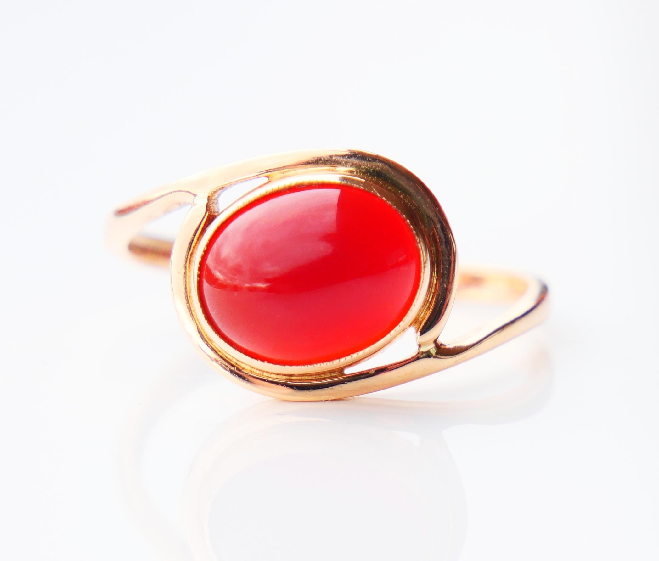 A ring featuring cabochon cut and polished natural Carnelian stone set into 14K solid Rosy / Orange Gold framing.

Hand - made in Poland in 1950s -1960s. Hallmarked 14K , Socialist period hallmarks.

Carnelian measures 10mm x 8mm x 4mm deep / ca.