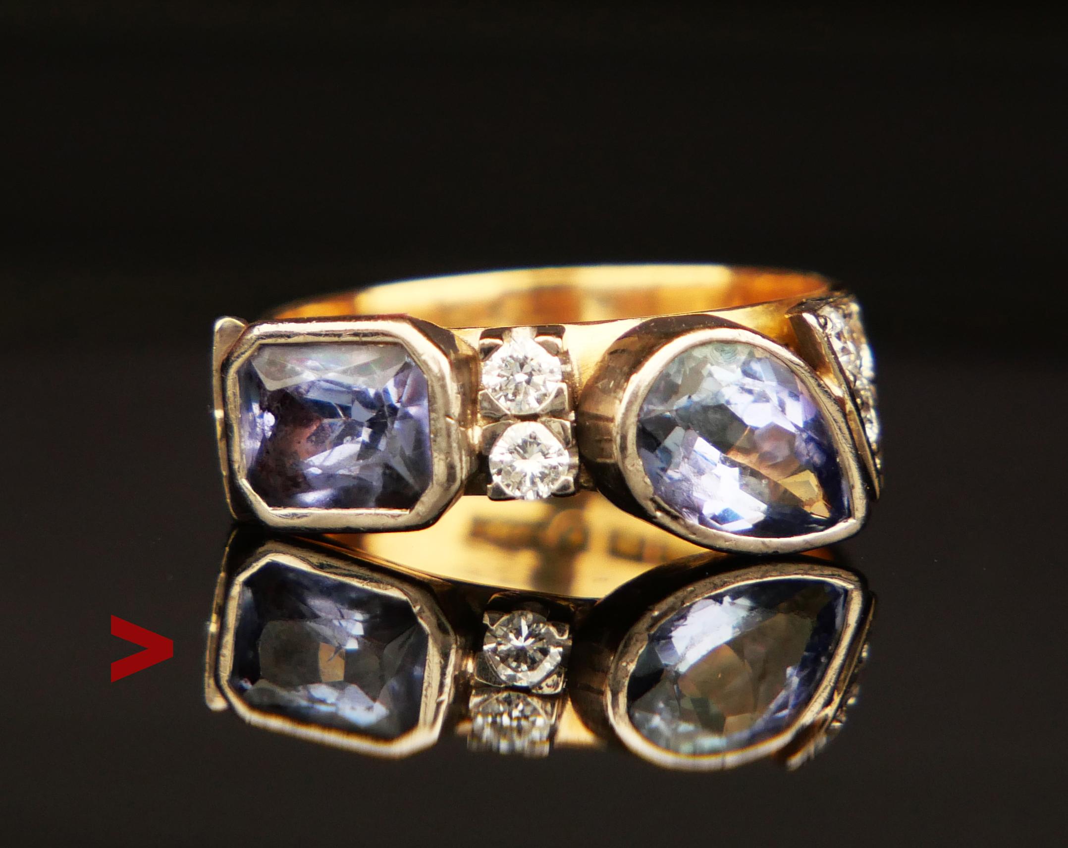 A Ring in solid 18K Gold featuring two natural Tanzanites and 6 Diamonds. Settings in White Gold or Platinum.

Swedish hallmarks, 18K, year combination N11 / made in 2011

Baguette cut Tanzanite 7.75 mm x 5.75 mm x 3.7 mm / ca. 1.3 ct, the second