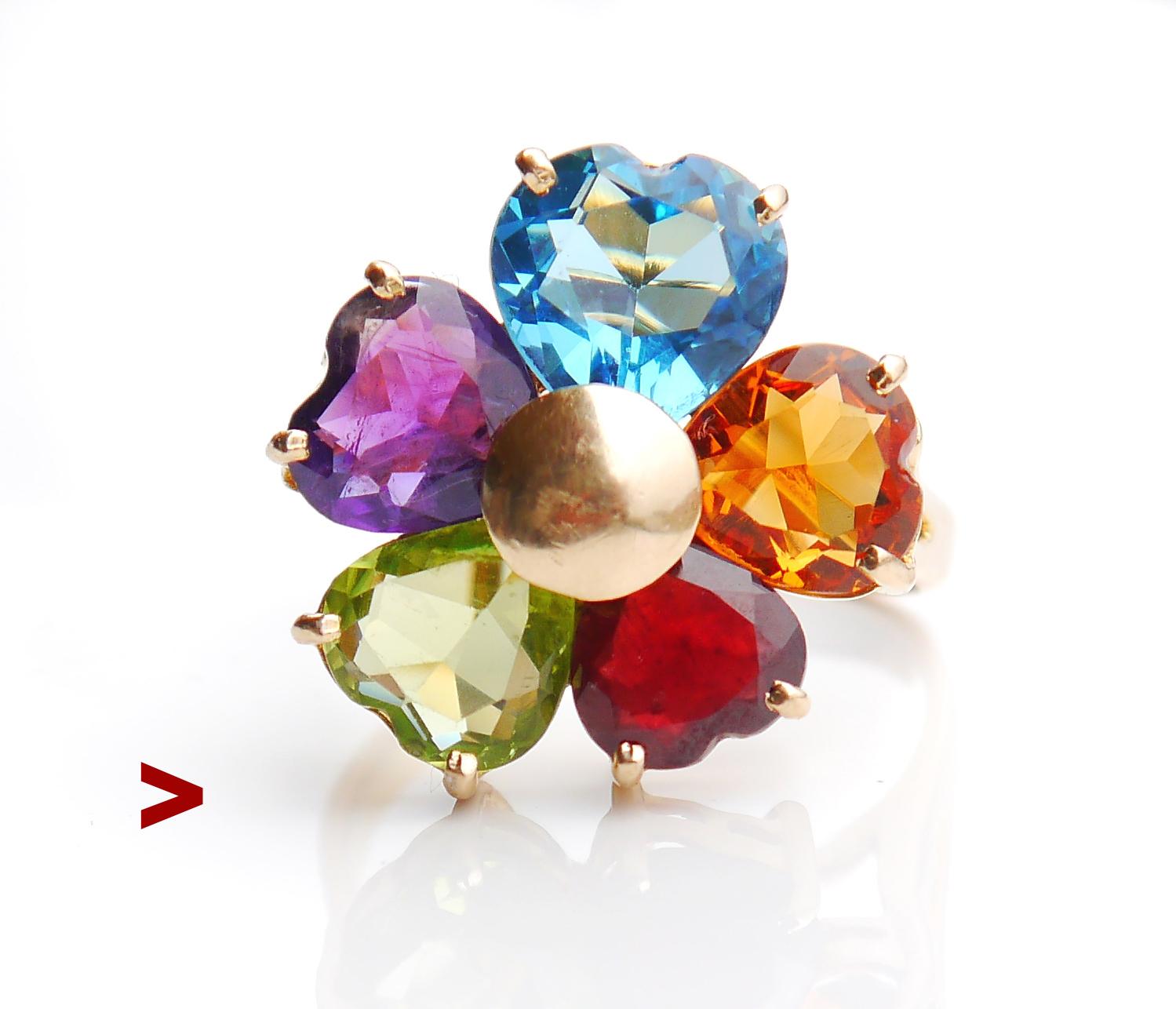 Flower ring in solid 14K Yellow Gold, petals cut of natural colorful gemstones, all heart cut.

Largest blue Topaz is 10 mm wide / ca 3.5 ct;cognac colored Citrine is 8.5m wide /1.8ct ; Garnet 7.5mm /1.59ct;

Green Peridot is 8mm /ca. 1.7ct ; purple