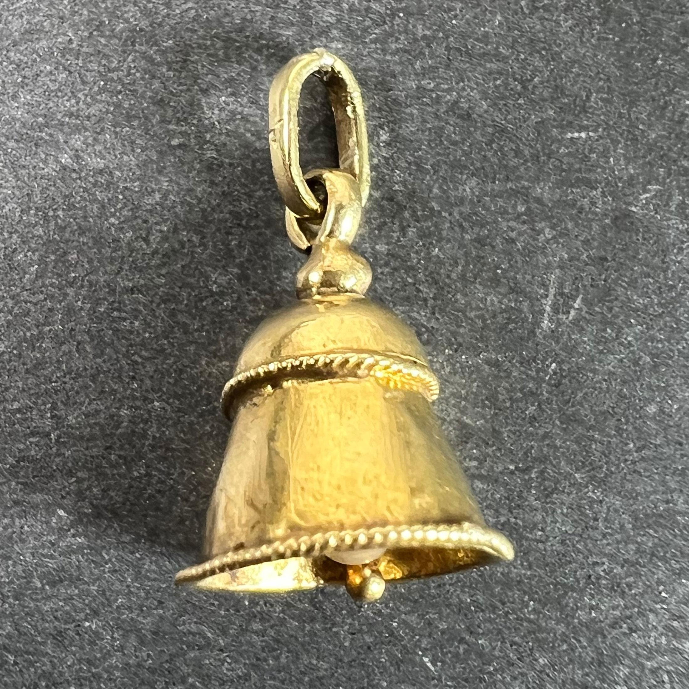 A vintage 18 karat (18K) yellow gold charm pendant designed as a ringing wedding bell set with a cultured pearl to the ringer. Unmarked but tested for 18 karat gold.

Dimensions: 1.3 x 0.9 x 0.9 cm (not including jump ring)
Weight: 0.87 grams
(Chain