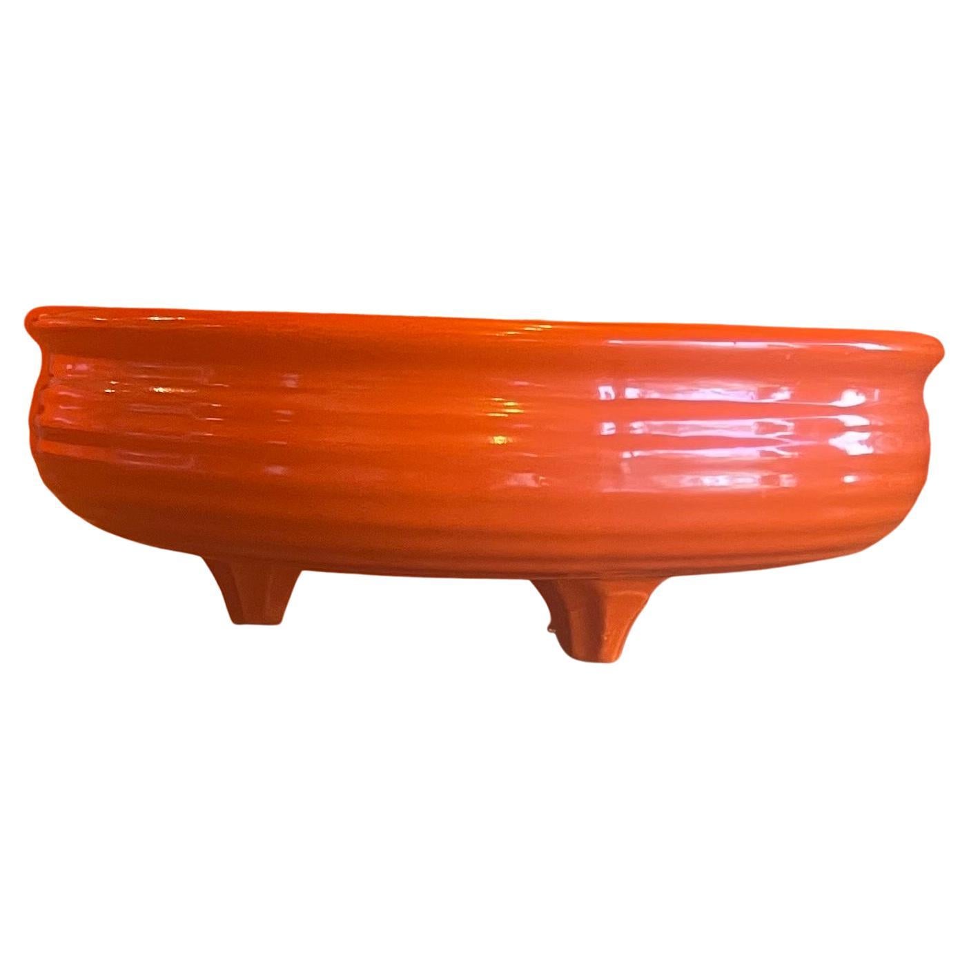 Vintage ringware footed fruit bowl in orange by Bauer, circa 1970's. The bowl is in very good vintage condition with no chips or cracks and measures 10.25
