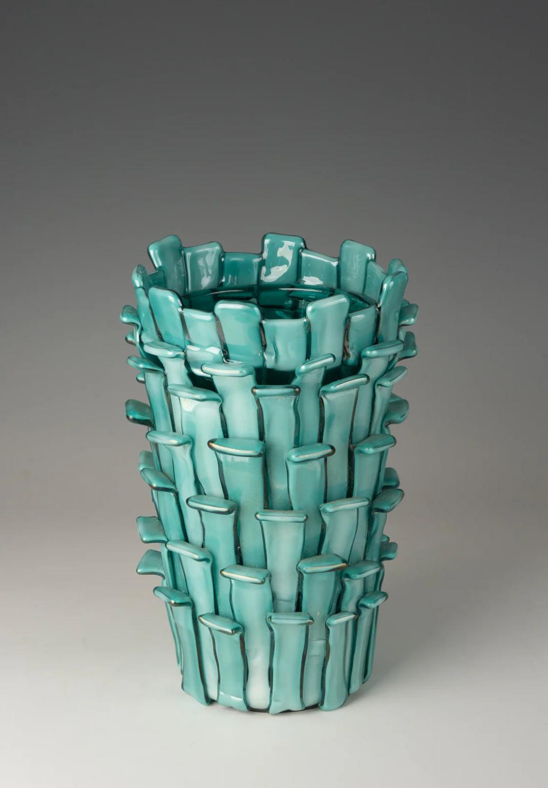 Designed by Fulvio Bianconi for Venini
Blown handmade vase with colored inserts
Transparent blown glass can either be clear or colored by the addition of small quantities of metal oxides. transparent glass is sometimes slightly iridescent, and is