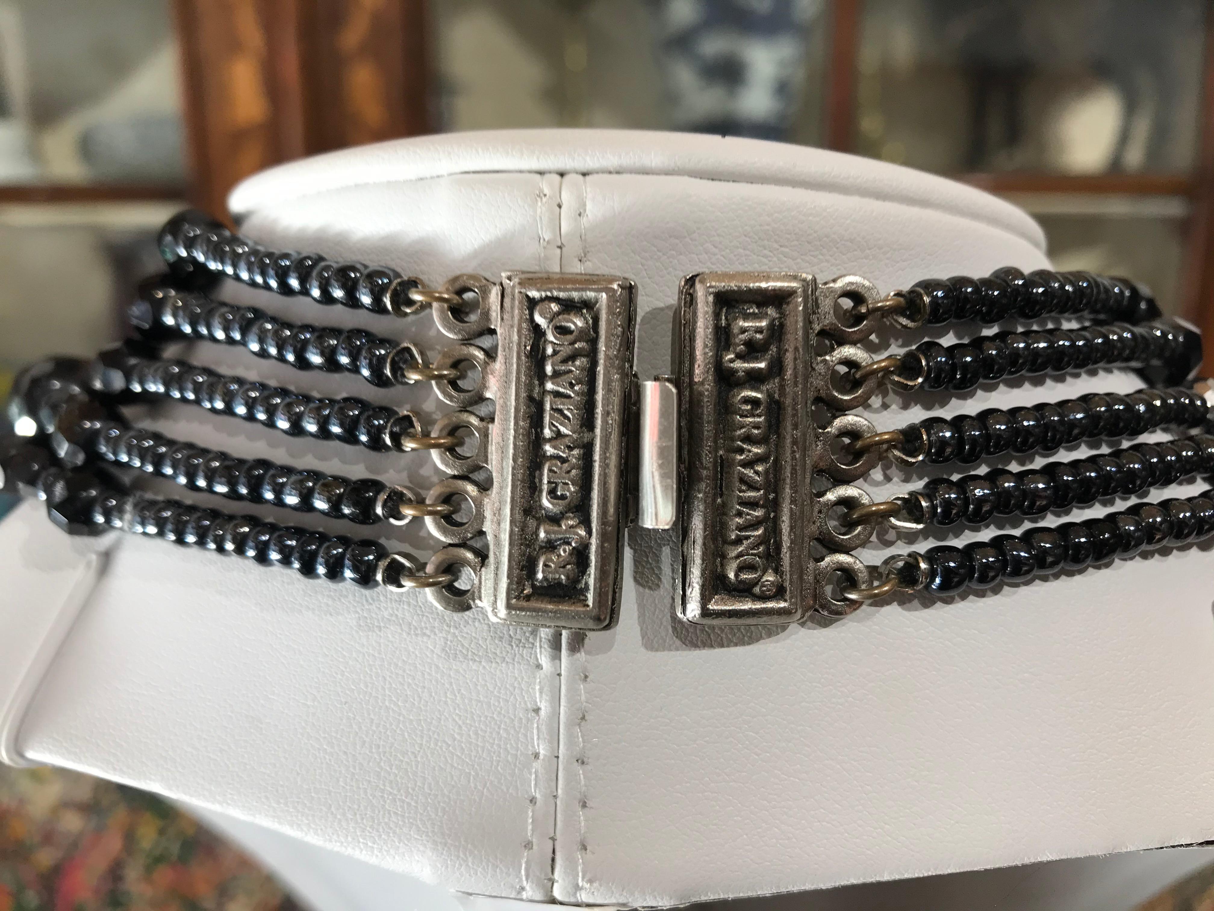 Beautiful Signed R.J. Graziano Designer Multi-Strand Bib Necklace; comprising of 5 strands of faceted black glass beads of varying sizes further enhanced with small sparkling glass beads and held with a signed R.J. Graziano silver tone box clasp,
