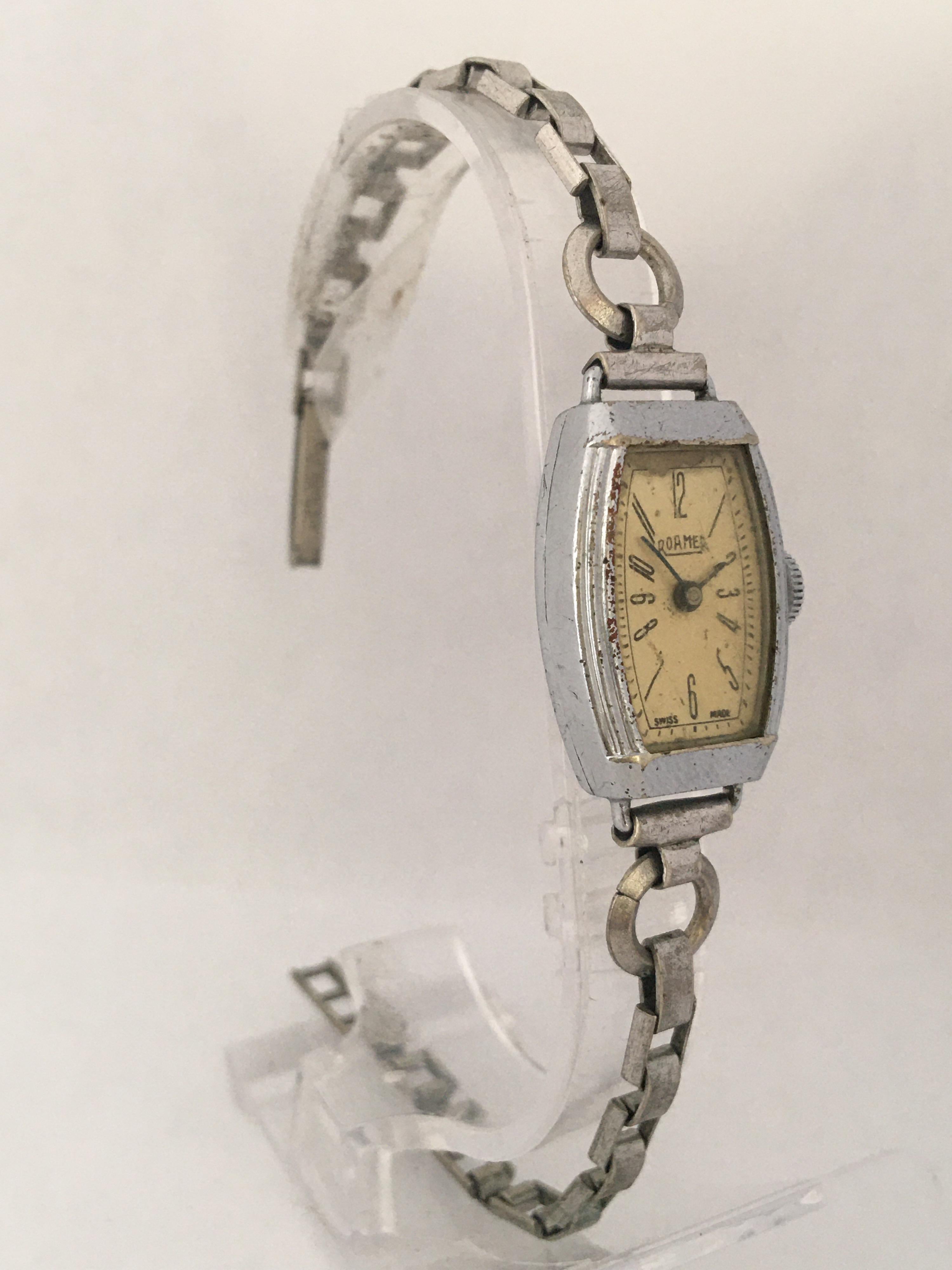 This beautiful vintage hand winding ladies watch is working and it is running well. Keeps a good time. Visible signs of ageing and wear with some scratches on the watch case and light scratches on the glass. The watch case is a bit tarnished as