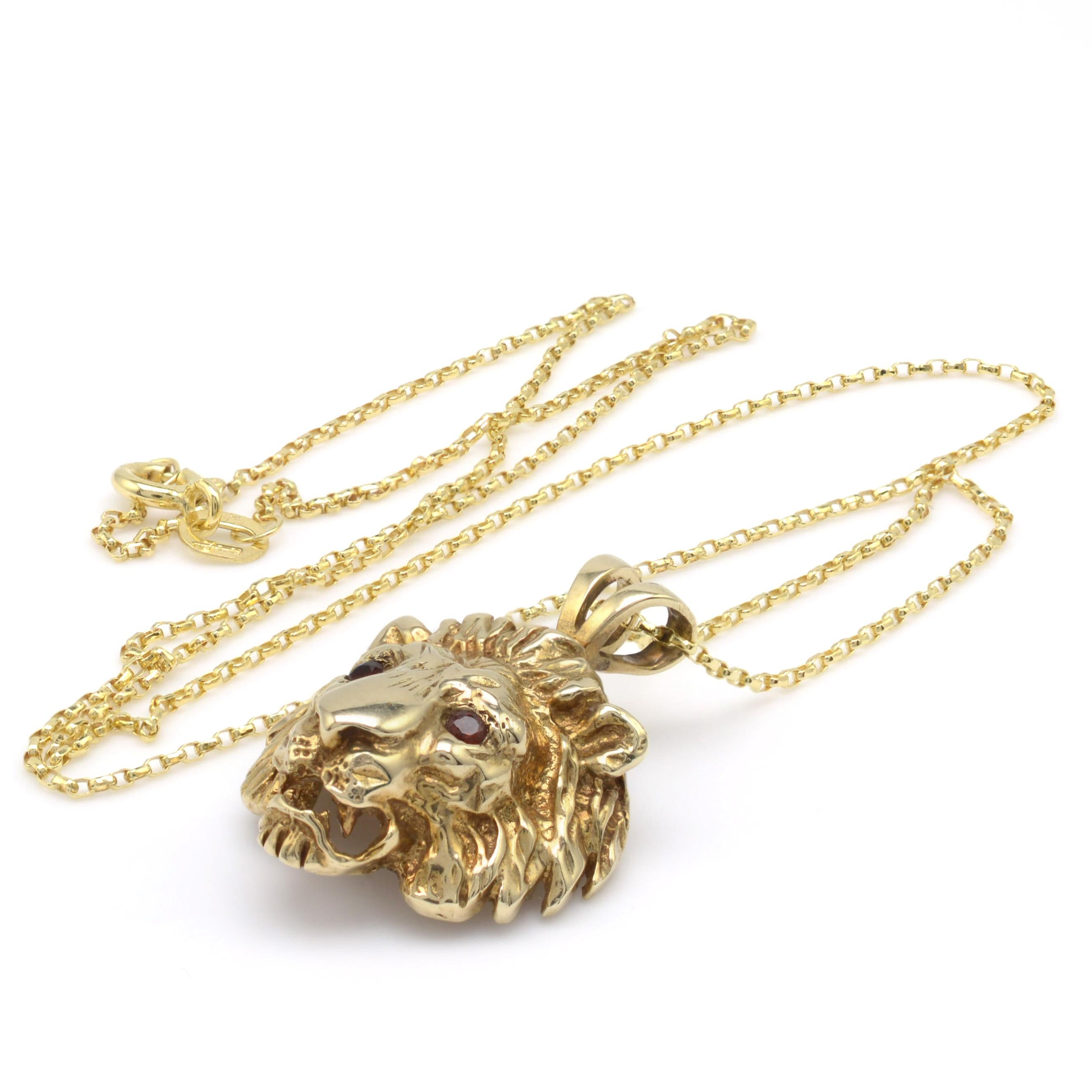 A superb solid yellow gold Lion pendant necklace with gemstone set eyes and complete with complimentary 18-inch lightweight gold belcher chain. Circa 1970s

- Lion weight: 5.3 grams
- Chain weight: 1.1 grams
- Hallmarks: Full assay marks to the