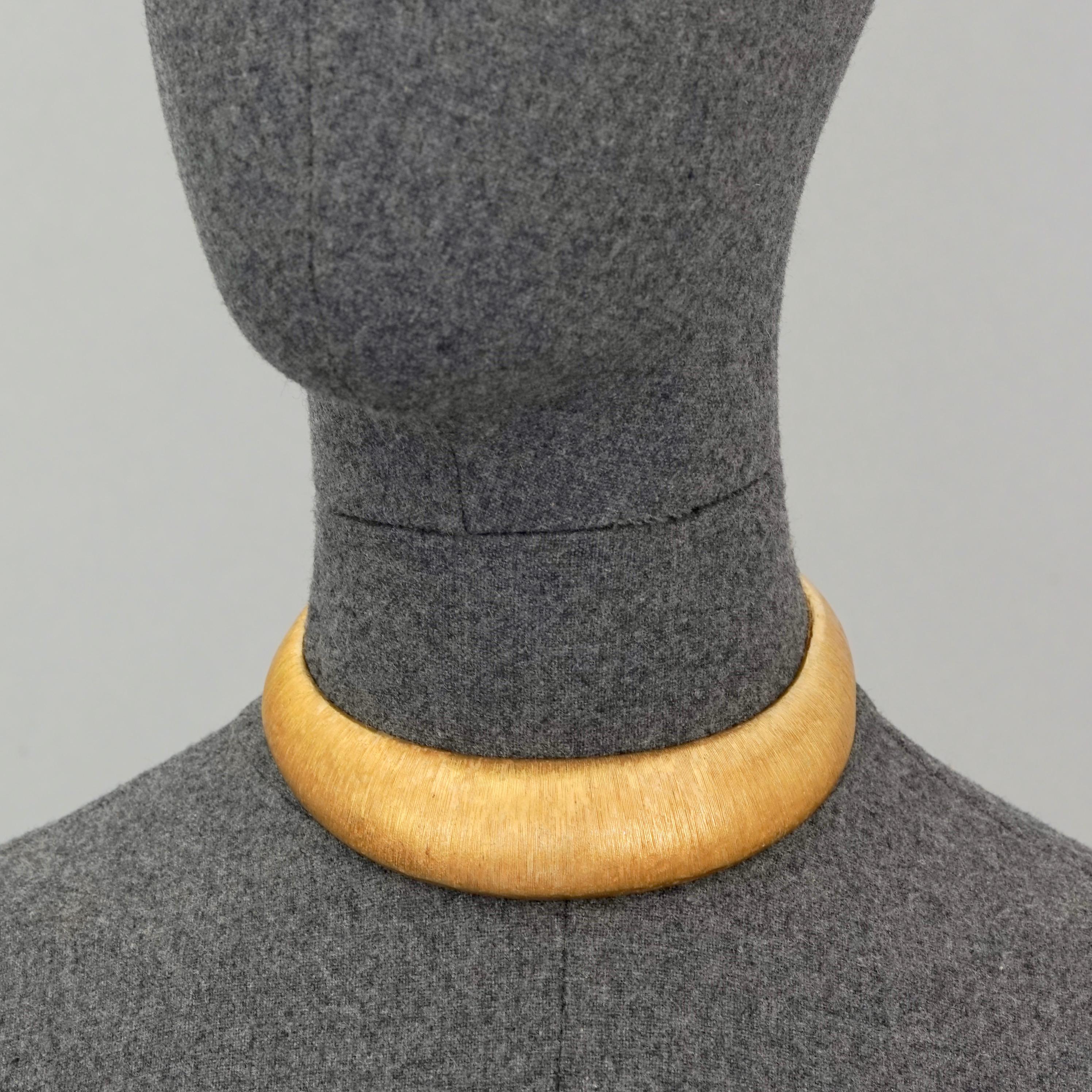 Vintage ROBERT GOOSSENS Textured Brushed Gold Rigid Choker Necklace

Measurements:
Height: 0.98 inch (2.5 cm)
Inner Circumference: 12.60 inches (32 cm) includes opening

Features:
- 100% Authentic YVES SAINT LAURENT.
- Textured rigid choker