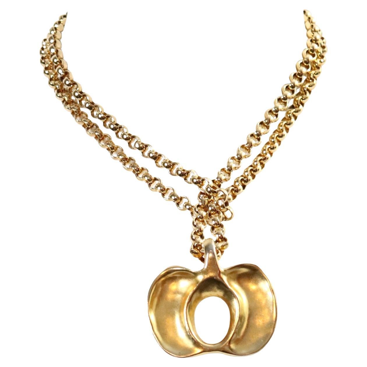 Vintage Robert Lee Morris Gold Pendant Circa 1980's.  This gorgeous RLM pendant could be abstract or many things.  Could be an apple or something else.  Not sure but it is chic and quite current and will always be on trend.  It is on a  long Rollo