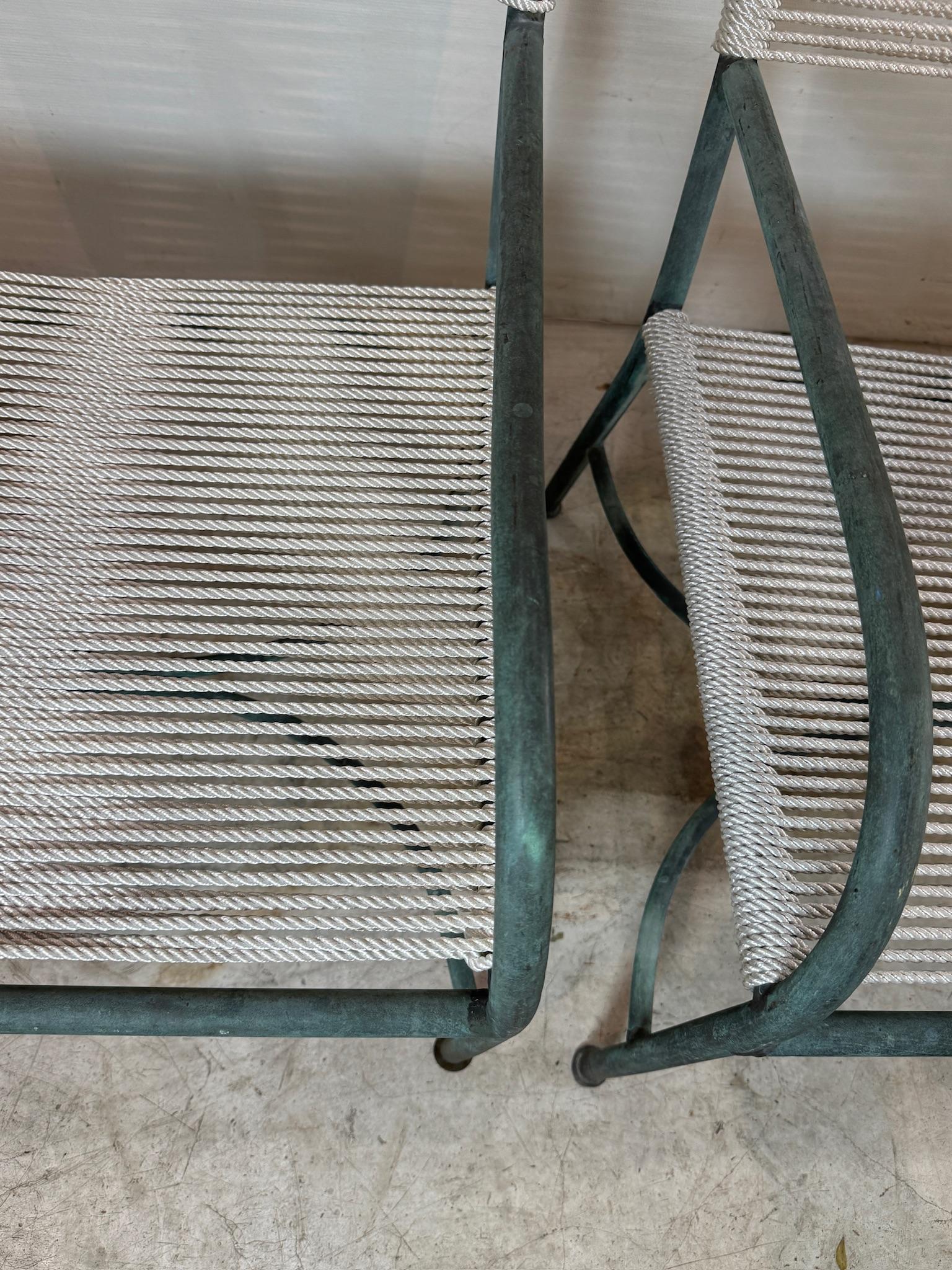 An early California-made bronze patio lounge chair by Robert Lewis, a predecessor to Walter Lamb. These were made by hand in the 1930's-1940's in Santa Barbara, CA.  This stunning vintage pair features elegantly slender bronze tubing, sculpted into