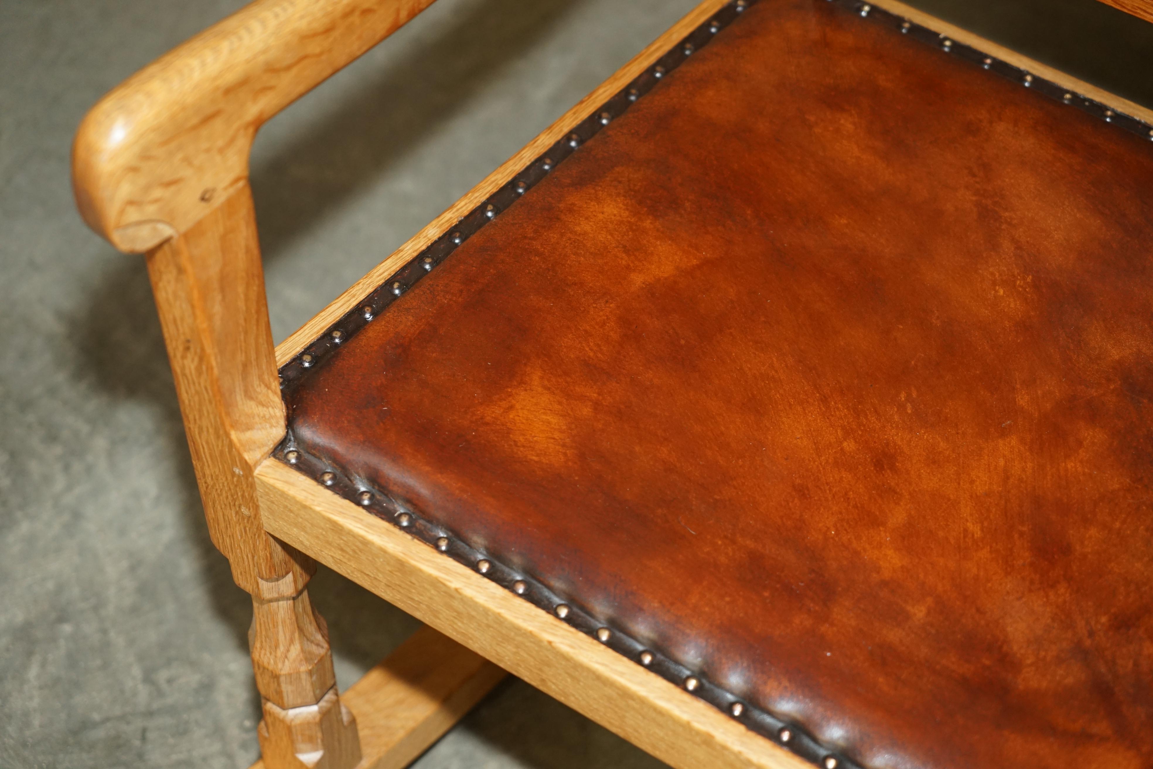 Hand-Carved VINTAGE ROBERT MOUSEMAN THOMPSON ROCKING ARMCHAiR HAND DYED BROWN LEATHER SEAT For Sale