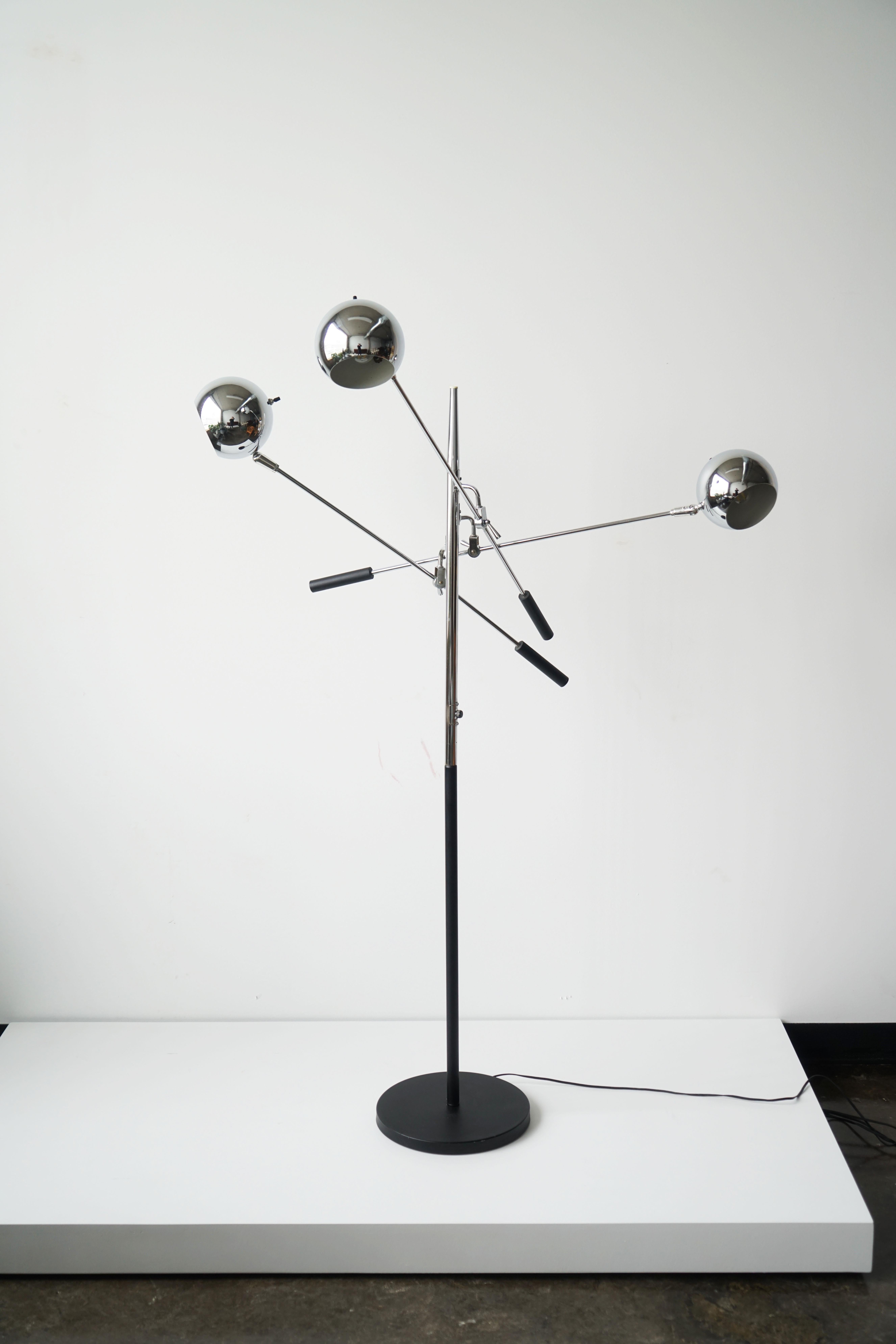 Vintage 3-arm floor lamp designed by Robert Sonneman.
circa 1970s. 

This lamp features three adjustable chrome orb light heads that pivot on balancing lever arms. A true classic and well-made lamp. 

Tested and in great working condition.