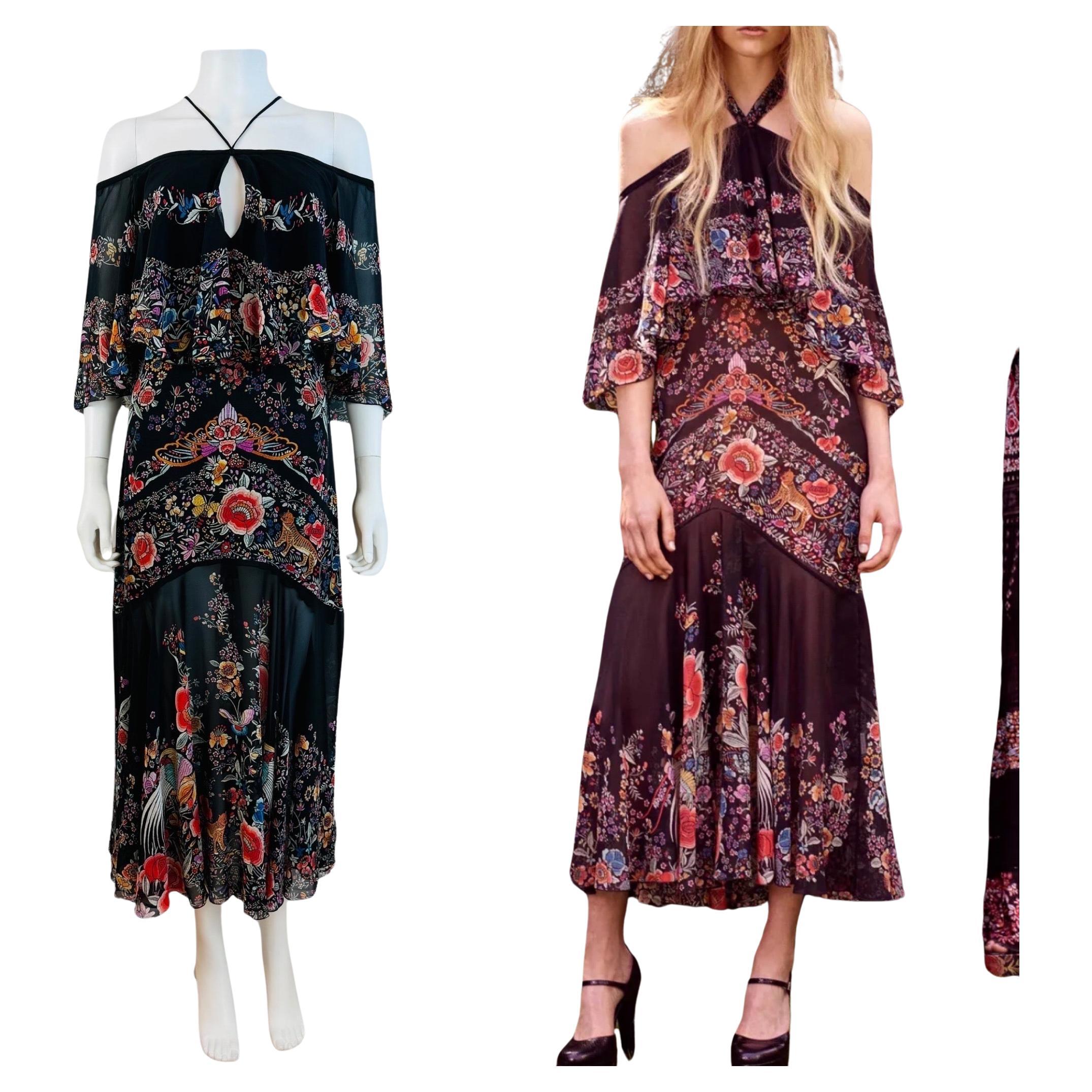 Vintage Resort 2017 Roberto Cavalli Dress
Semi sheer chiffon black silk fabric with vibrant floral + bird print throughout
Halter tie neckline with long ties that go to the back of the dress + can be tied multiple way - can be tied around the waist