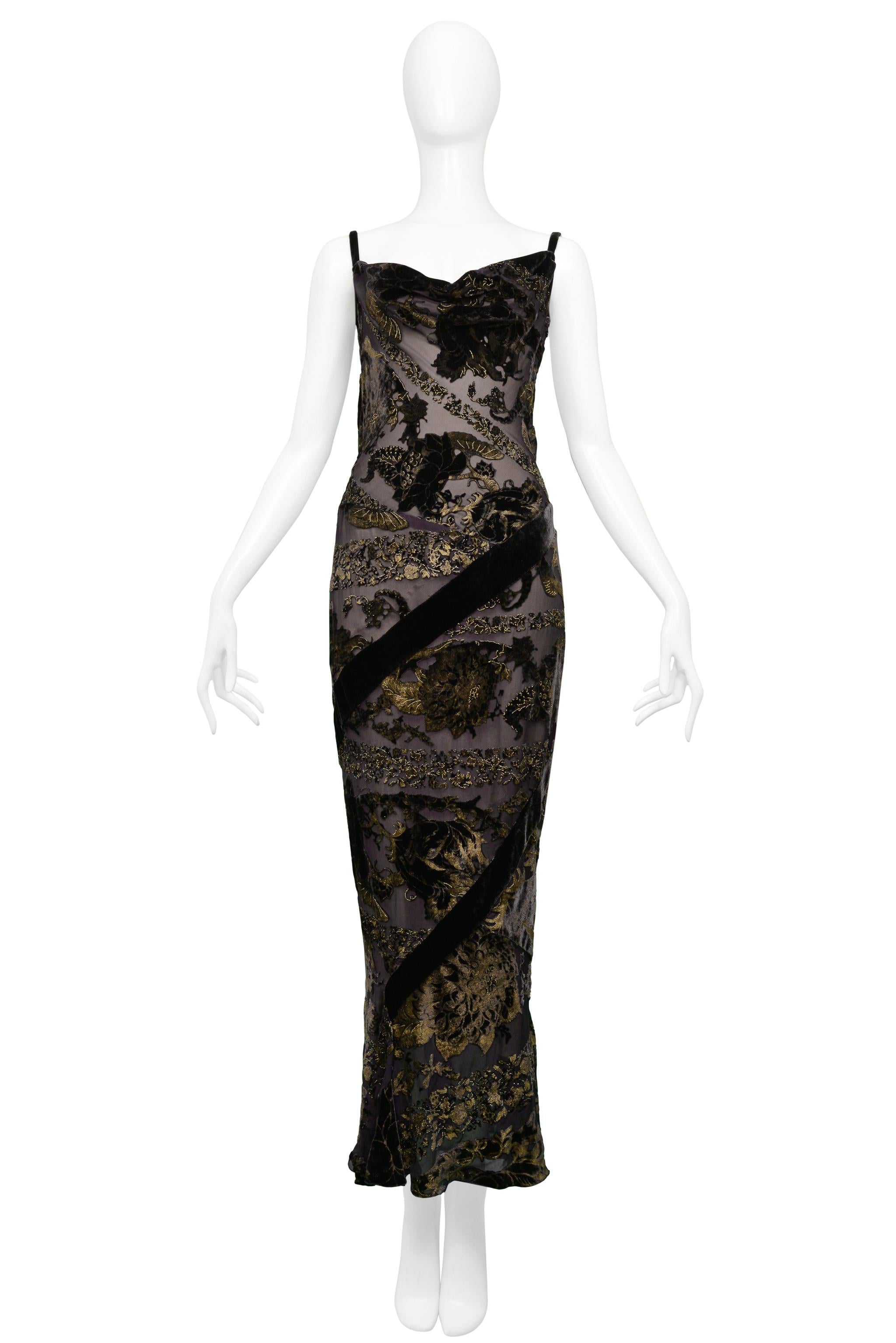 Resurrection is excited to offer a vintage Roberto Cavalli black chiffon bias cut gown featuring a draped neckline, open back, black and gold floral devoré velvet pattern, velvet panels and side zipper closure.

Roberto Cavalli
Chiffon & Velvet
Made