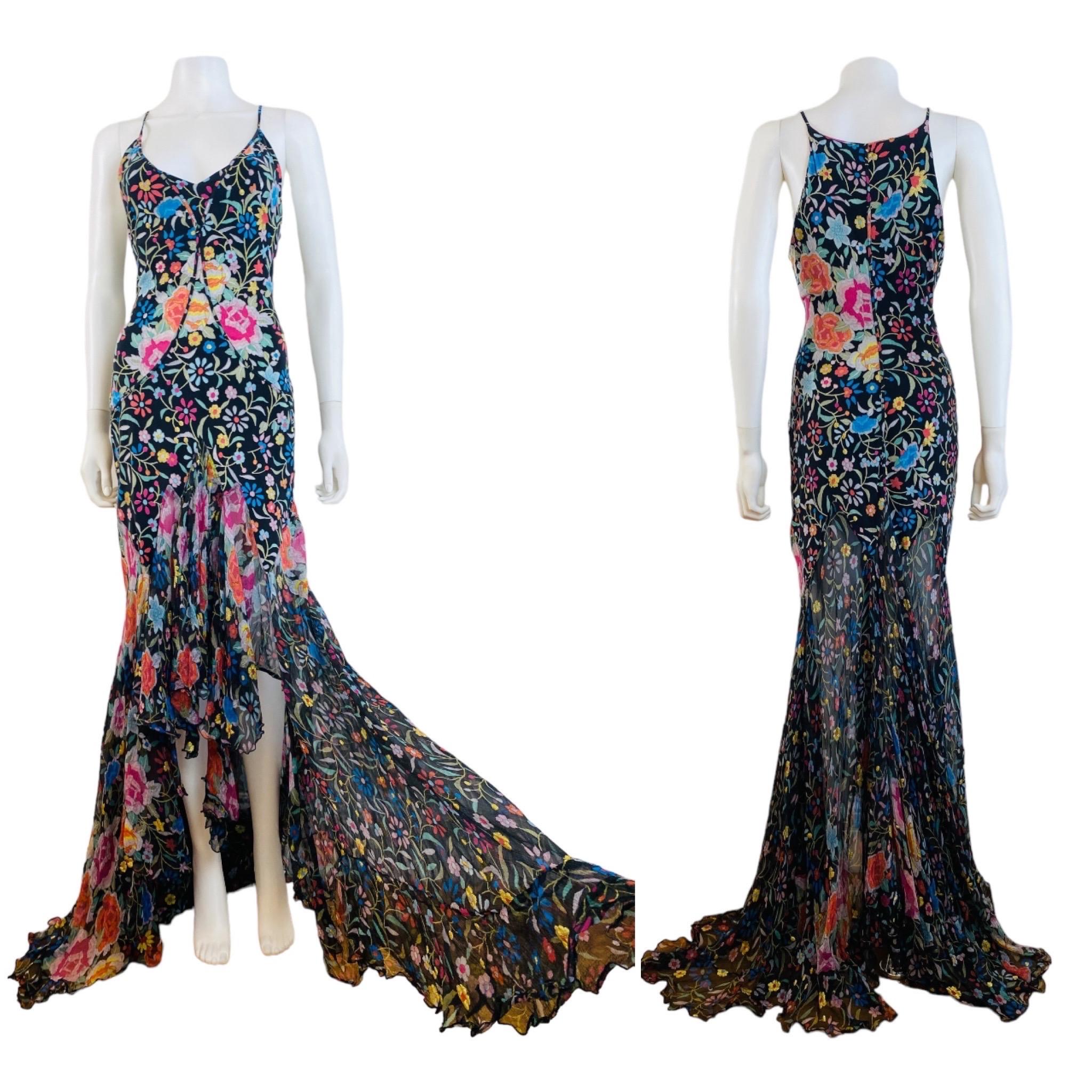 Incredible F/W 2004 Roberto Cavalli Dress (shown pinned to mannequin)
Black stretch silk fabric (silk + lycra) with embroidered look floral pattern throughout with gold glitter accent flowers
Form fitted dress through the hips with ultra flared