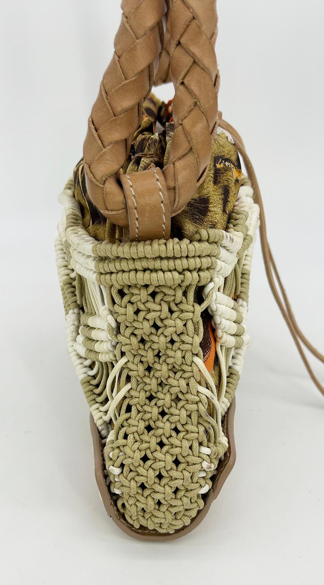 Vintage Roberto Cavalli Macrame Silk Drawstring Baguette in very good condition. Multi color leopard print silk lining with cream and tan macrame overlay, tan leather trim and matte gold hardware. Braided tan leather handle that can transition