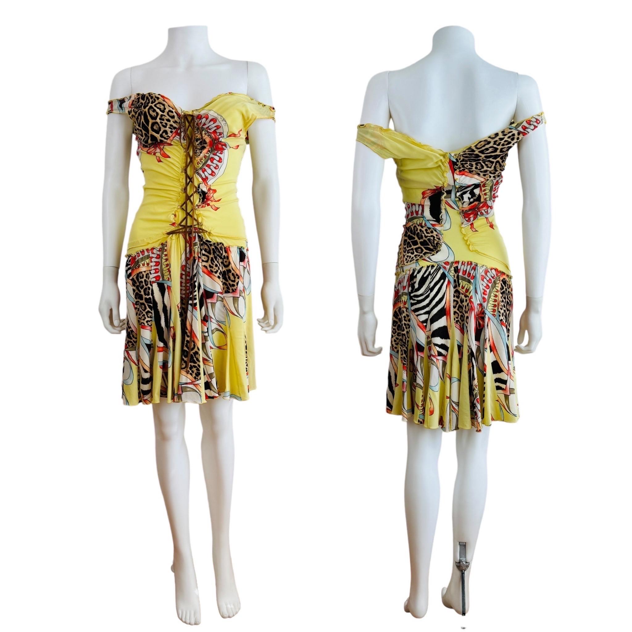 Vintage S/S 2004 Roberto Cavalli Dress
Lemon yellow stretch silk fabric with bold abstract graphic + leopard animal print
Gold glitter accents on fabric
Deep v neckline
Built in internal shelf bra
Faux suede lace up detail down the front of the