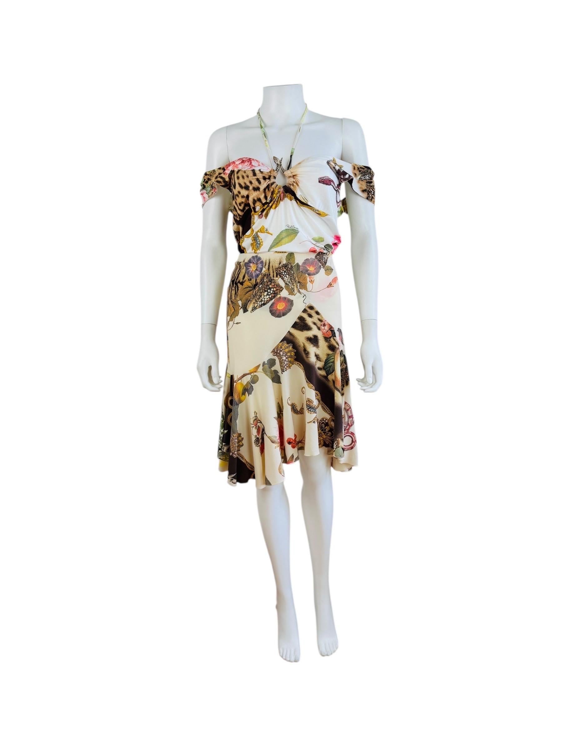 Roberto Cavalli Top + Skirt S/S 2005
Oversized floral, leopard, coral + seashell print fabric
White elastic + viscose fabric sleeveless top with plunging neckline, gold metal + rhinestone snake medallion at the bust + long ties at the bust that are