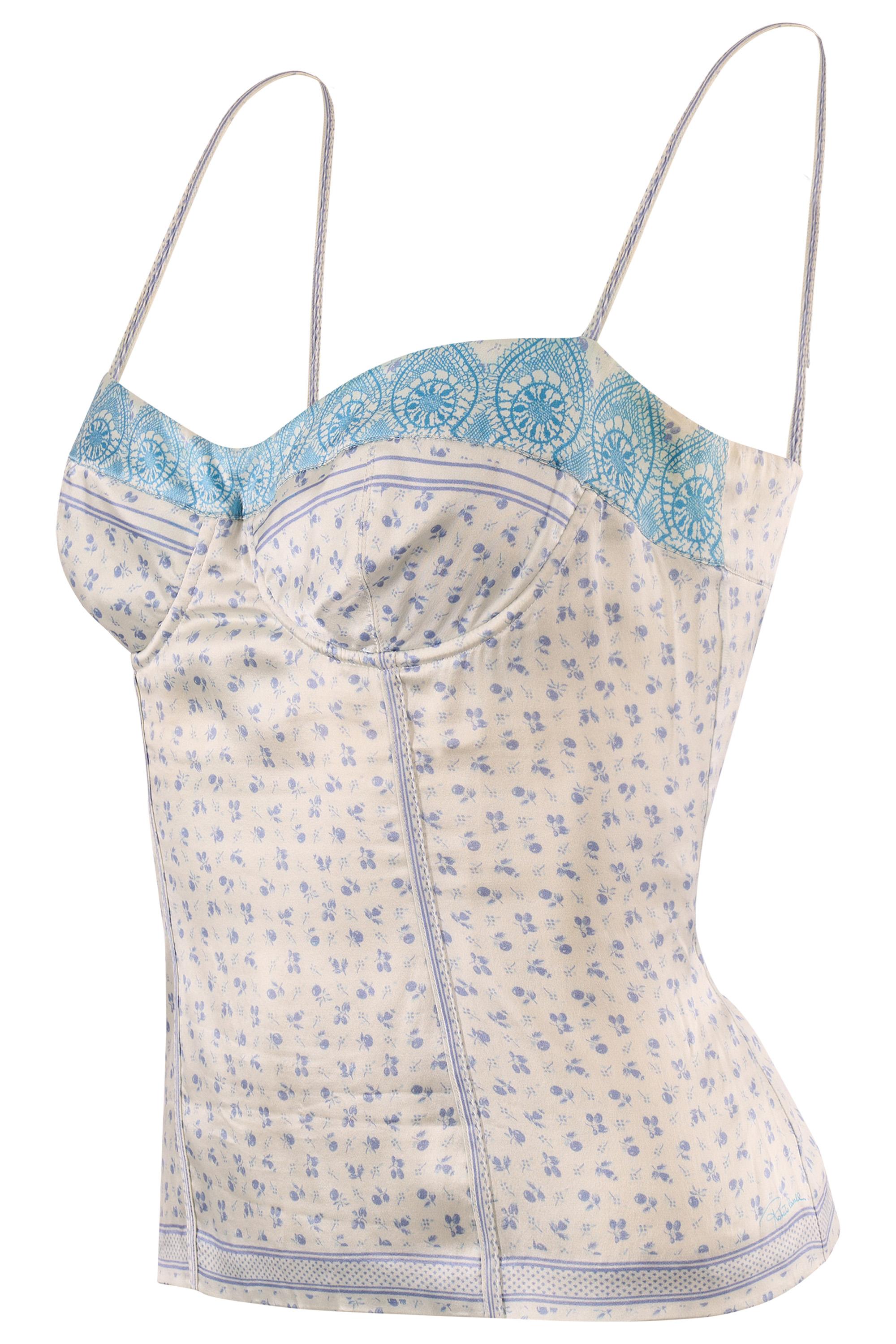 Questa delicata canotta in seta di Roberto Cavalli  Presenta una morbida base avorio con sfumature blu.  Cuciture strutturate in stile bustier per una vestibilità comoda e un bordo in pizzo turchese smerlato. Cinghie a spaghetti. Si chiude con una