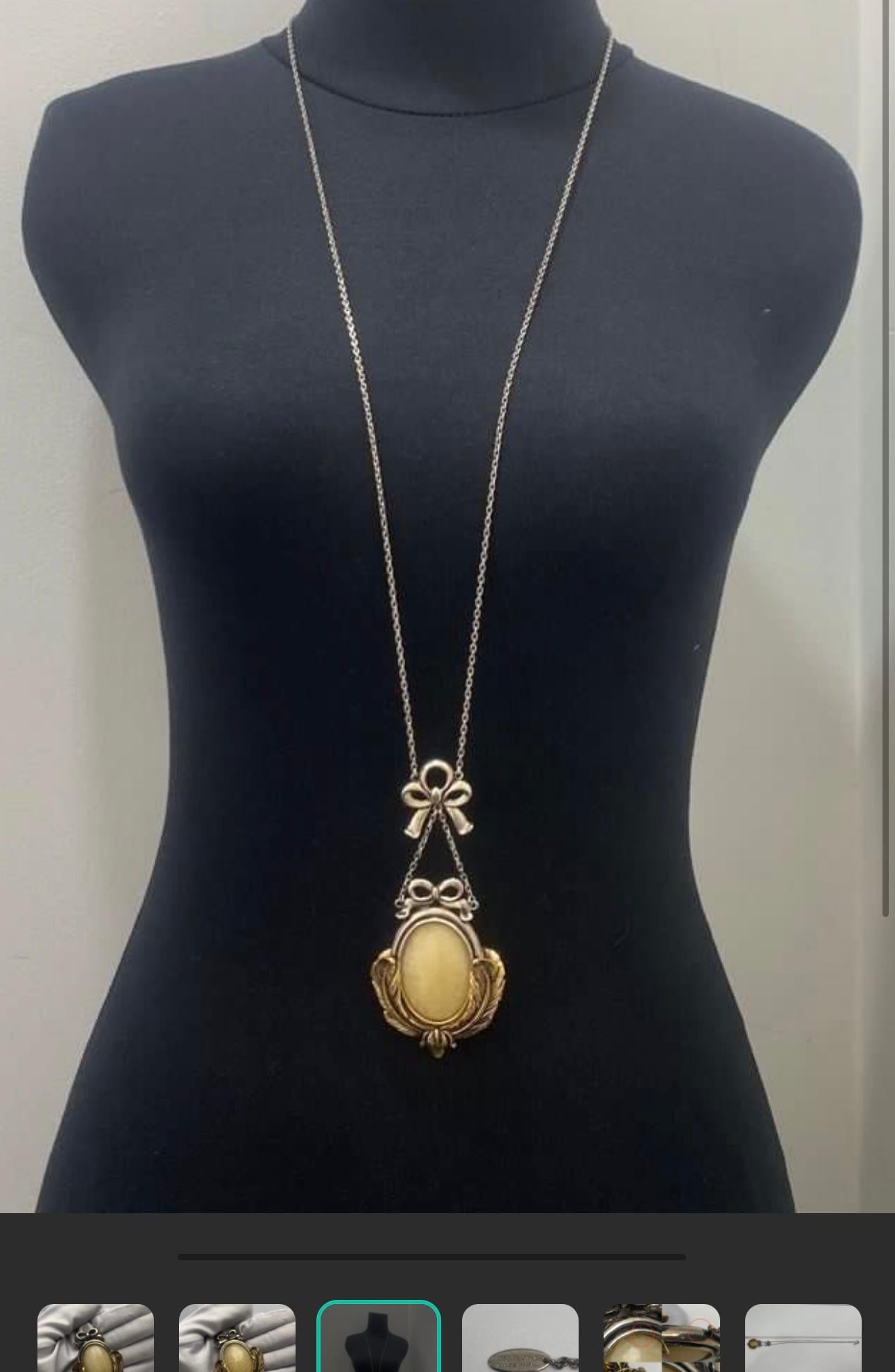 Vintage roberto cavalli necklace with huge stone and bow metal design. Long chain necklace, perfect for day to day or center piece. Comes as is. Mix of Gunmetal hardware and gold hardware. The line on the stone is part of the design, not defect. 