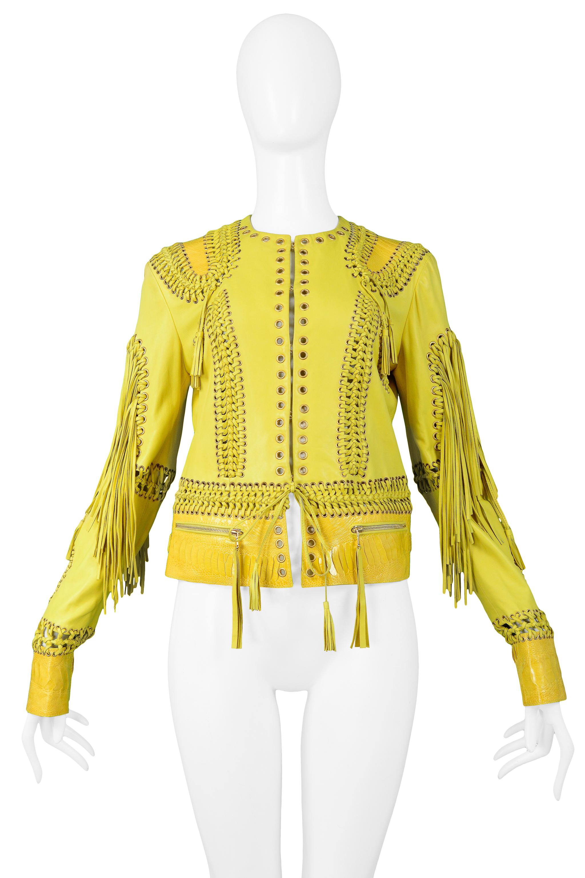 We are excited to offer a vintage Roberto Cavalli yellow leather jacket featuring embossed leather detail at cuffs, shoulders, and waist, lace-up detail throughout, grommet accents and fringe at arms. 

Roberto Cavalli
Size 40
Leather
Made In