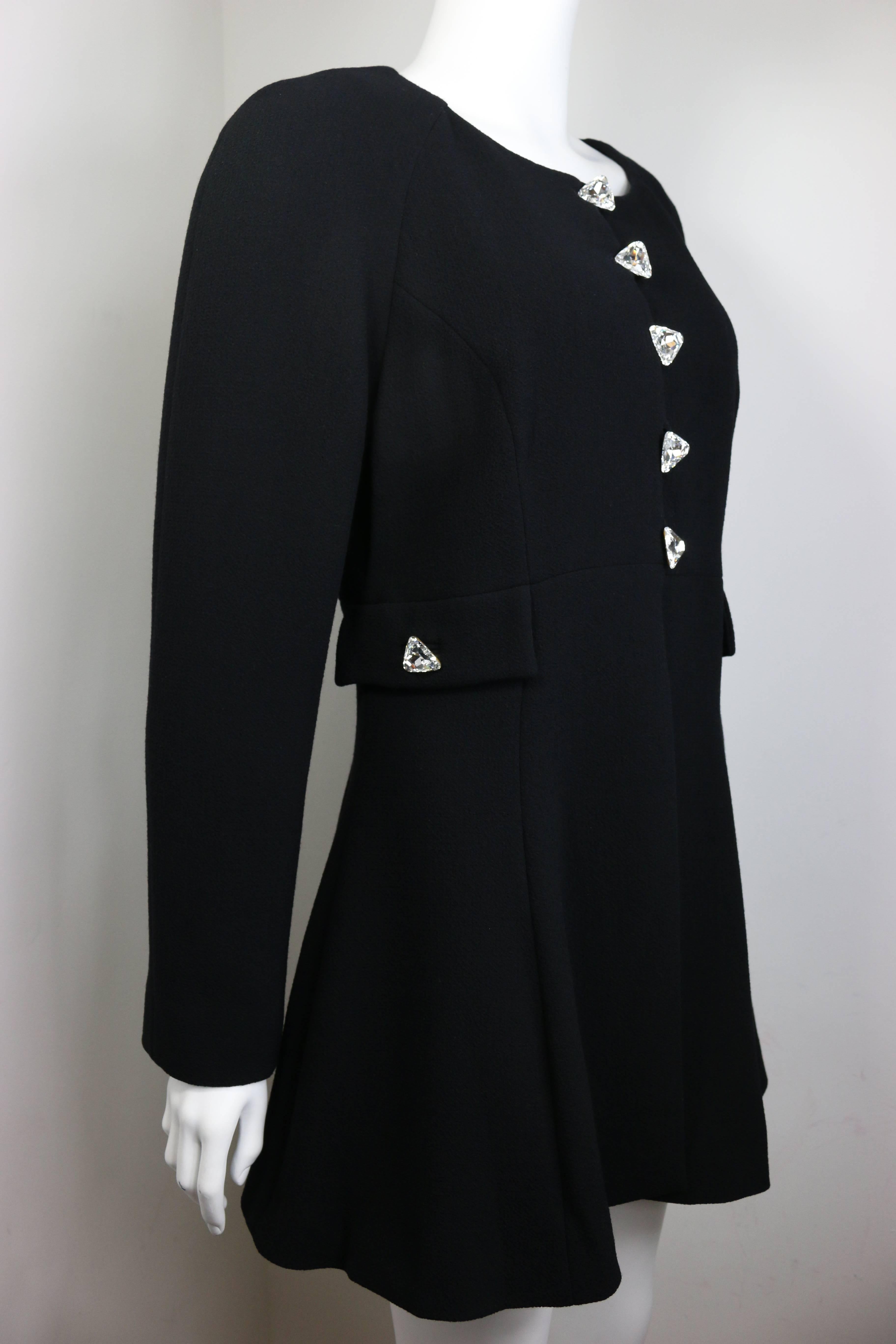 - Vintage Rochas round shoulder black boucle wool coat from fall 1994 collection. 

- 100% Silk floral print inside lining. 

- Featuring five front triangle rhinestone buttons and two triangle rhinestone buttons on the side flaps. 

- Made in