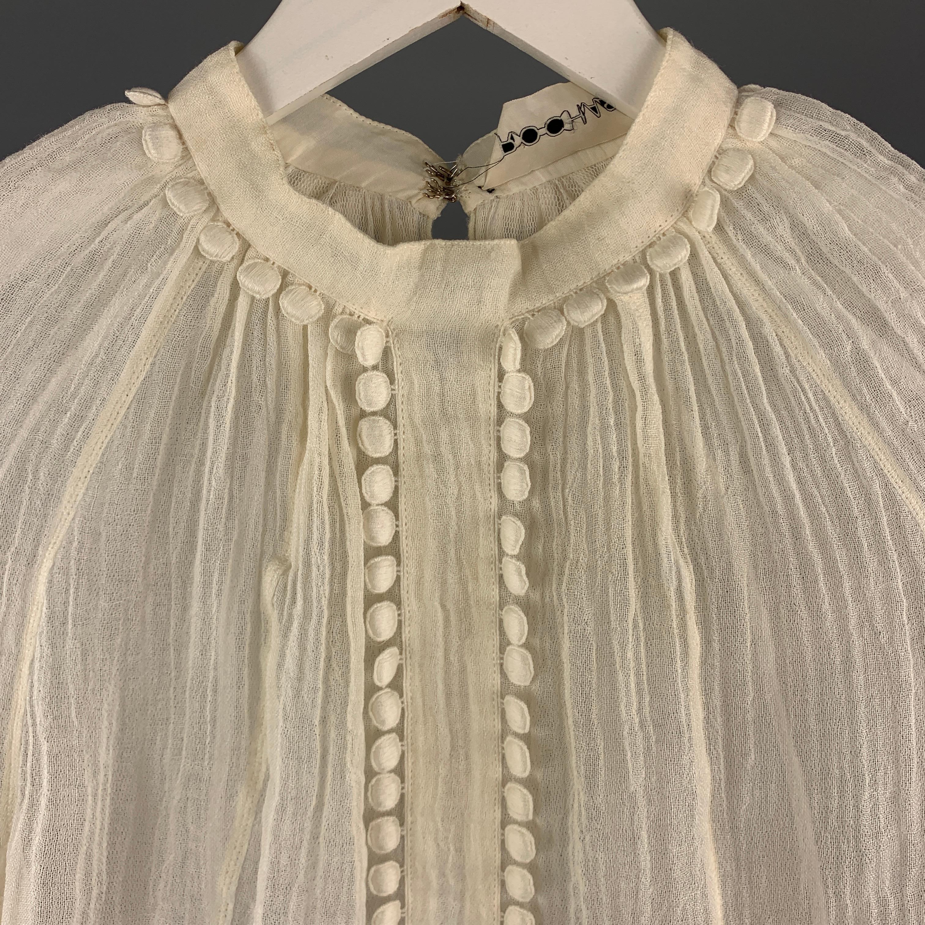 Vintage ROCHAS Blouse comes in a cream tone in a textured see through linen material, with a high collar, embellishment, and raglan long sleeves. As Is. Made in France. 

Very Good Pre-Owned Condition.
Marked: IT 38

Measurements:

Shoulder: 16.5